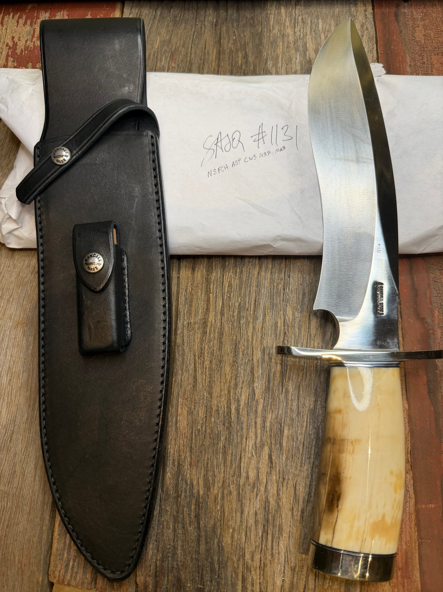 Randall Model 12-11 Dealer Special Large Sasquatch in a Huge piece of Creamy Fossil Walrus Ivory. Nickel Silver Hilt and Butt cap.