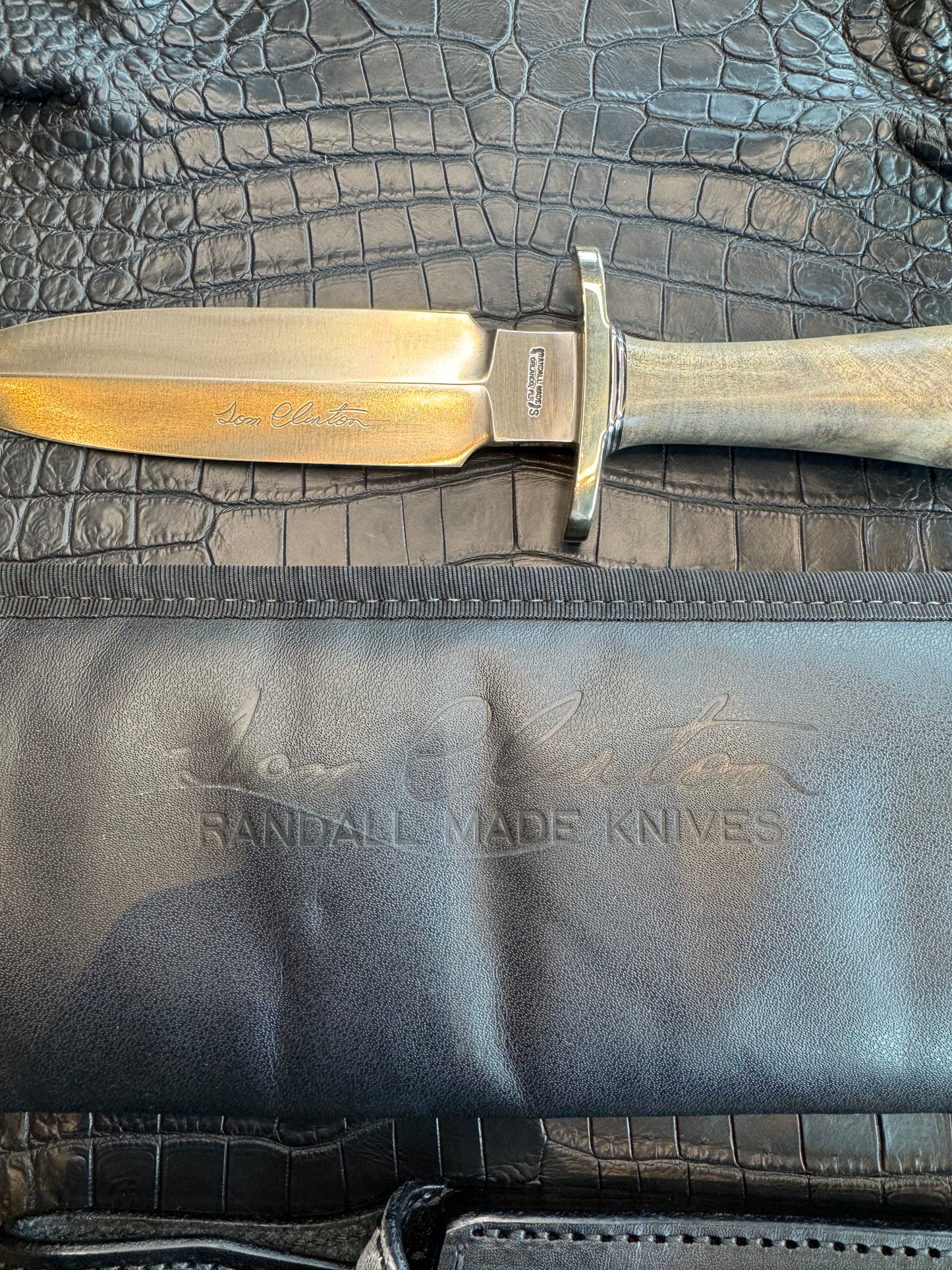 Randall Tom Clinton Dealer Special. Clinton Blade etched Commemorative 1/100 in a nice piece of Walnut. Very cool matching Elephant Gutcher sheath. Nickel Silver Hilt and Aluminum Coolie Butt cap. Included in black facsimile Tom Clinton case.