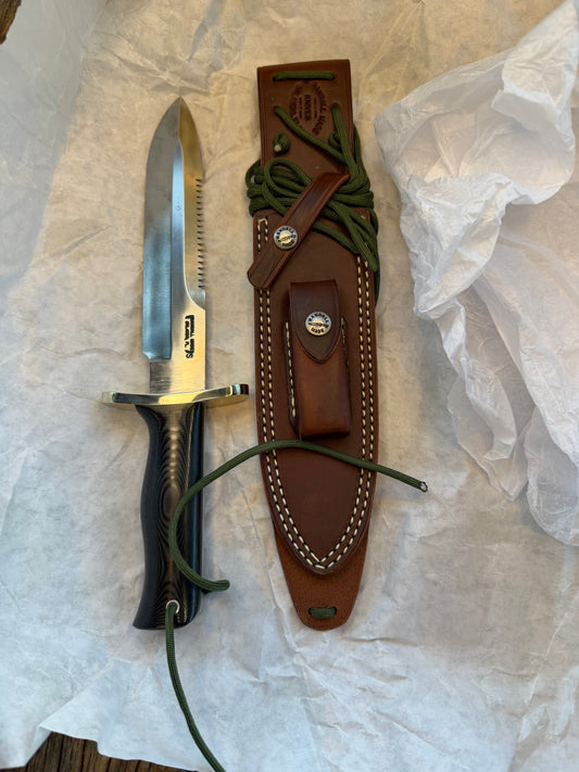 New in Paper Randall Model 14-7.5 in Black Micarta handle, Nickel Silver Hilt, Stainless steel, Sawteeth and Lanyard.