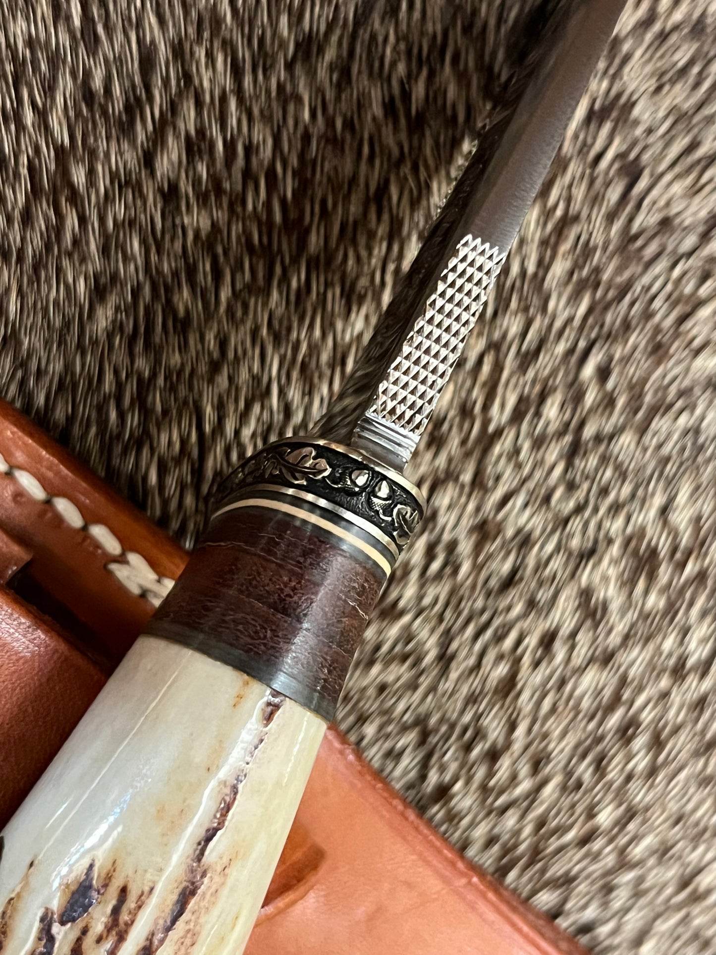 Model 25-Trapper 5” Tom Leschorn Carved, with Alaskan Gold Nugget Carved into a Buffalo