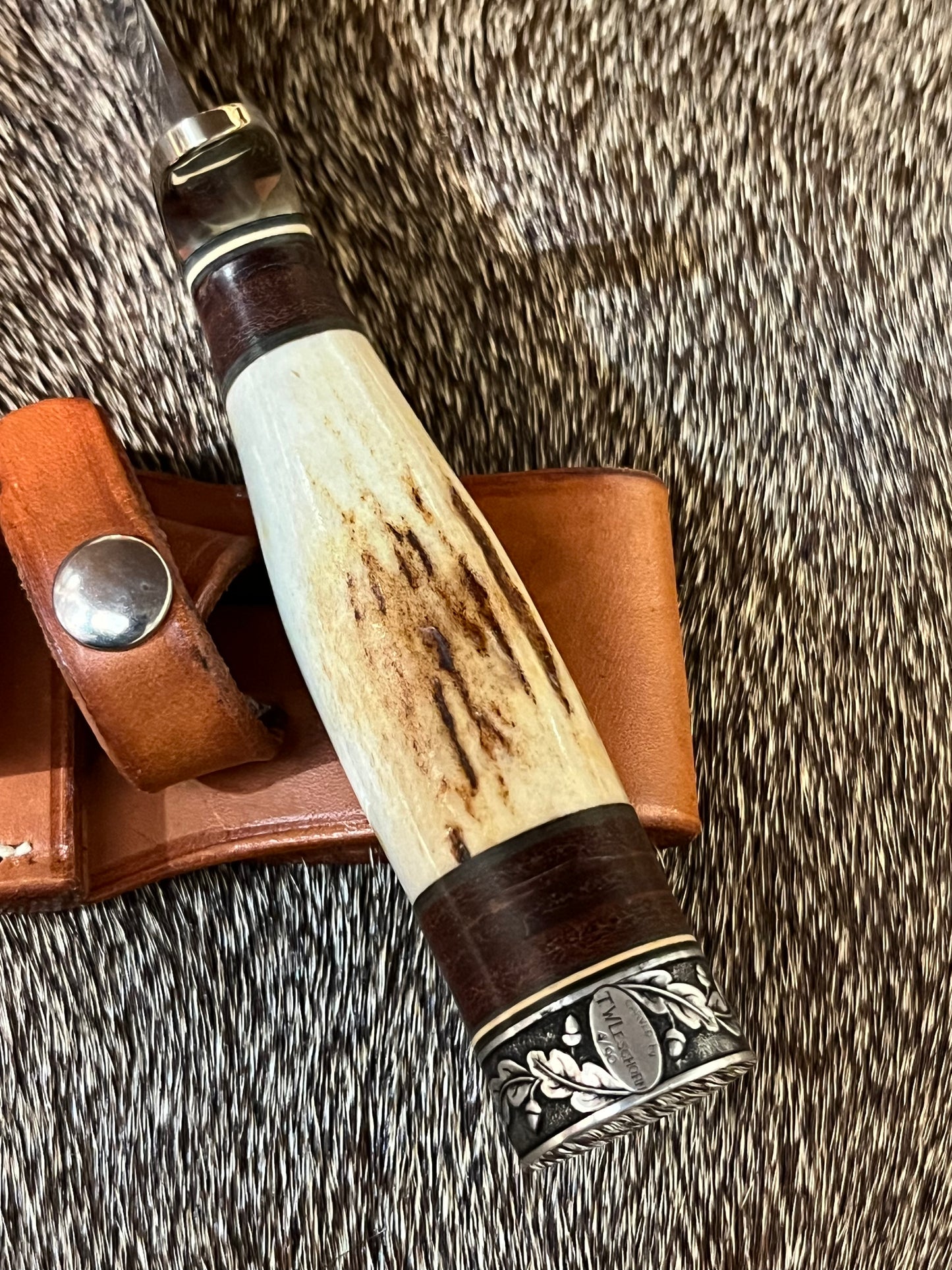 Model 25-Trapper 5” Tom Leschorn Carved, with Alaskan Gold Nugget Carved into a Buffalo
