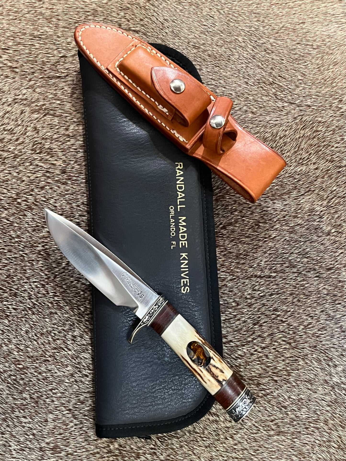 Model 25-Trapper 5” Tom Leschorn Carved, with Alaskan Gold Nugget Carved into a Buffalo