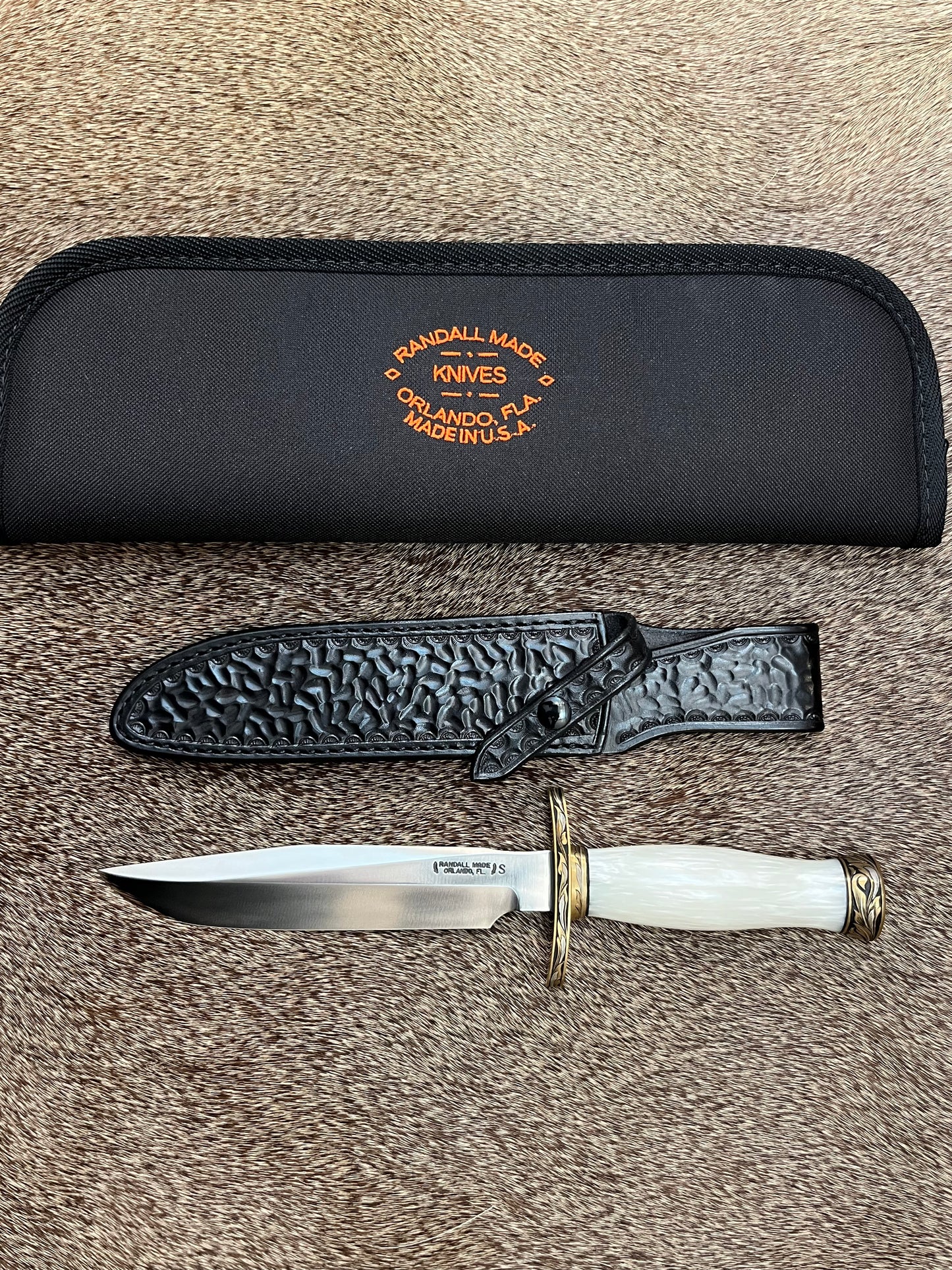 Model 1-7” All Purpose Fighting Knife, Engraved by Master Engraver Jere Davidson with Fine Silver Inlays, comes with Custom Black Leather Tooled Gutcher Sheath