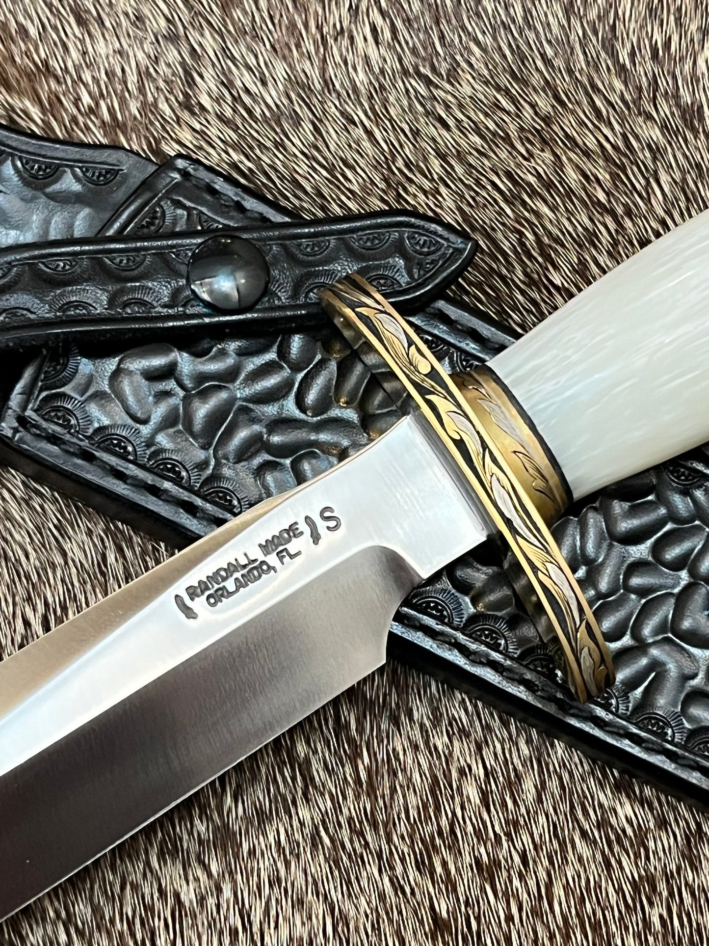 Model 1-7” All Purpose Fighting Knife, Engraved by Master Engraver Jere Davidson with Fine Silver Inlays, comes with Custom Black Leather Tooled Gutcher Sheath