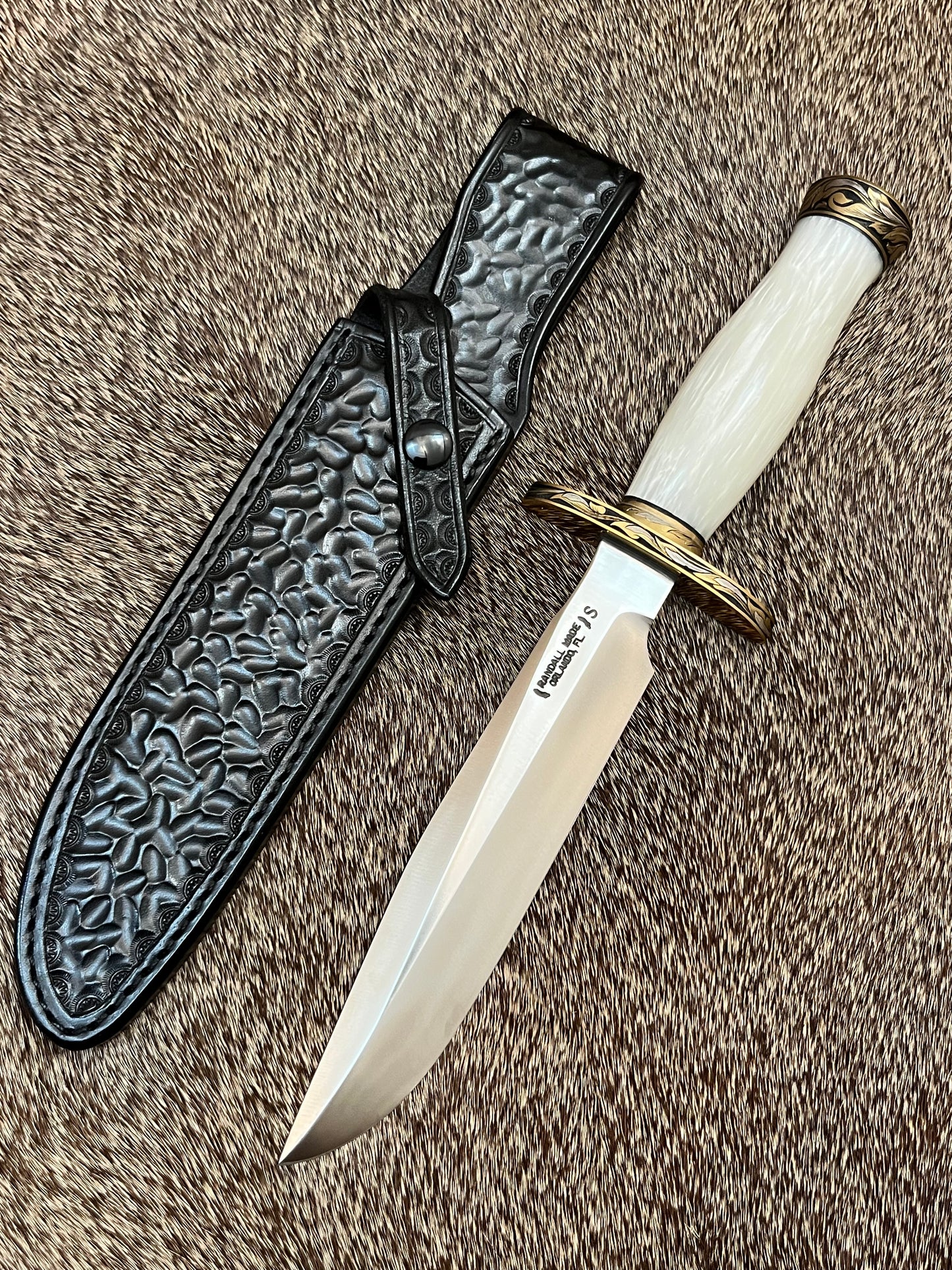 Model 1-7” All Purpose Fighting Knife, Engraved by Master Engraver Jere Davidson with Fine Silver Inlays, comes with Custom Black Leather Tooled Gutcher Sheath