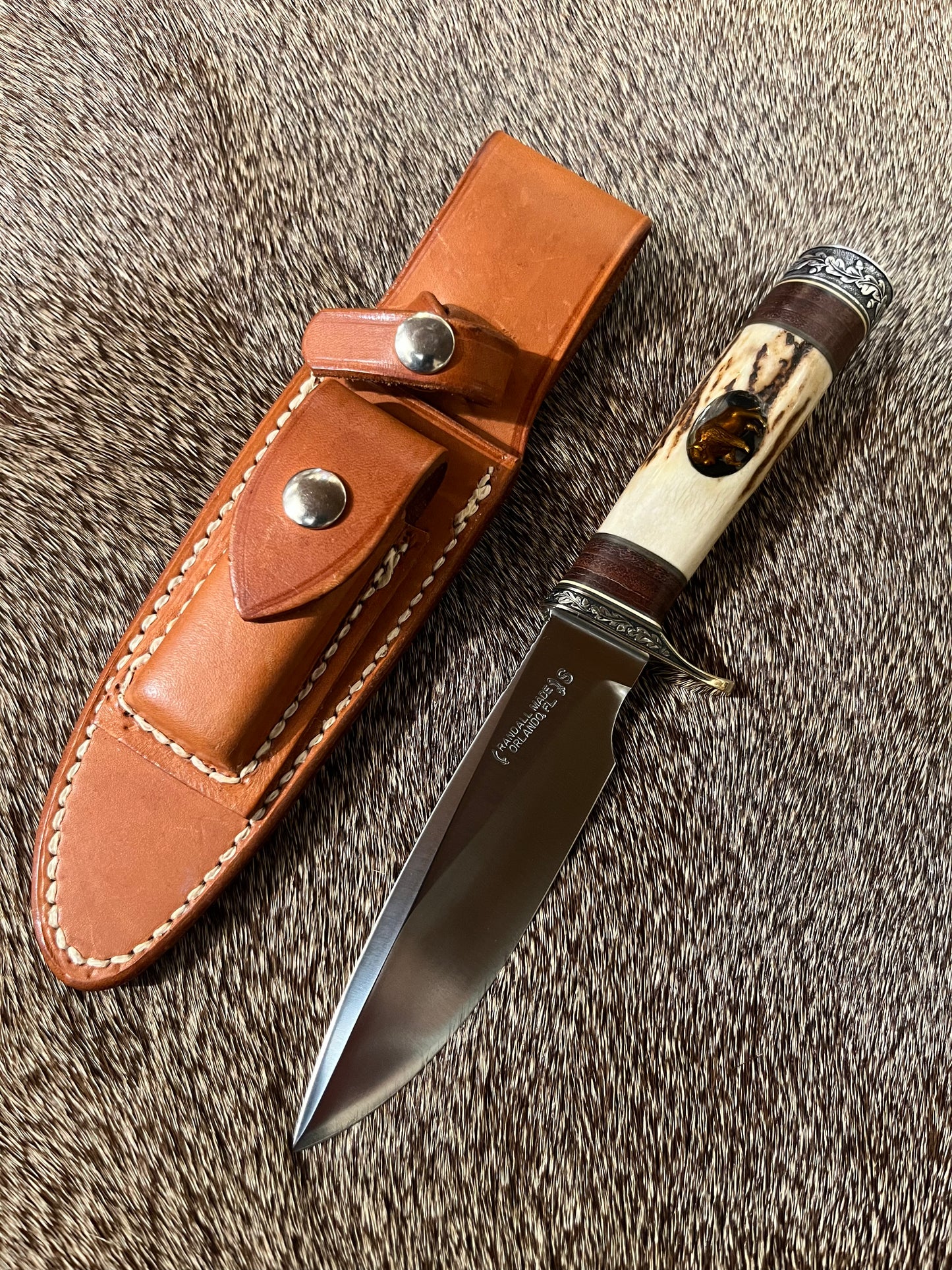 Model 25-Trapper 5” Tom Leschorn Carved, with Alaskan Gold Nugget Carved into a Buffalo