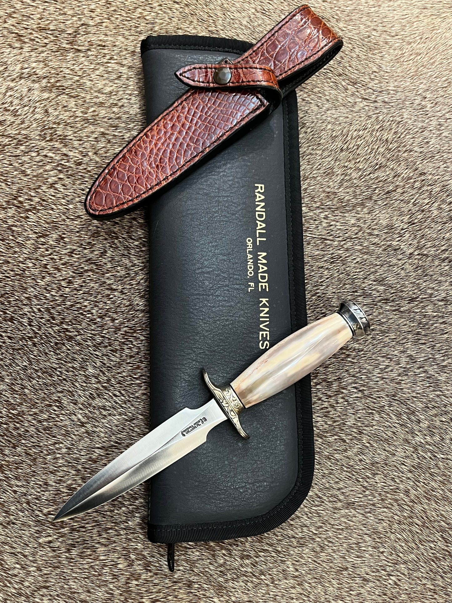 Model 2-5” Fossil Walrus with Custom Gutcher Sheath fully wrapped gloss brown crock, Engraving artist unknown, looks a lot like Ron Skaggs work