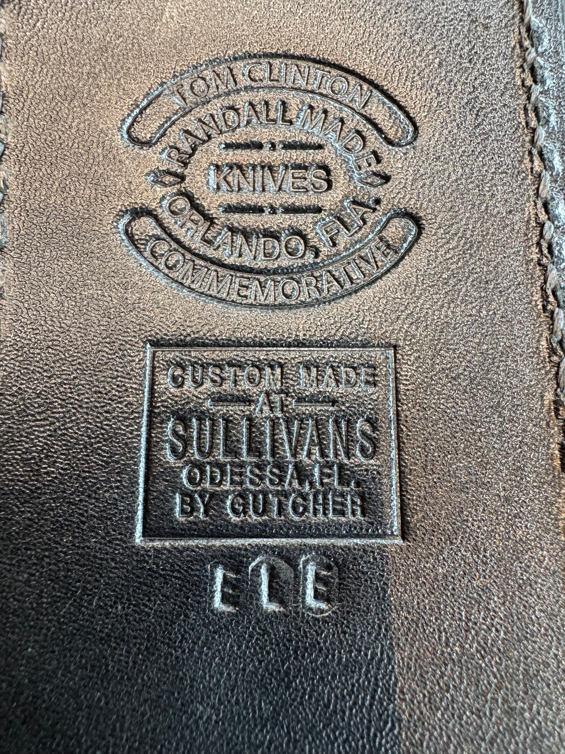 Randall Tom Clinton Dealer Special. Clinton Blade etched Commemorative 1/100 in a nice piece of Walnut. Very cool matching Elephant Gutcher sheath. Nickel Silver Hilt and Aluminum Coolie Butt cap. Included in black facsimile Tom Clinton case.