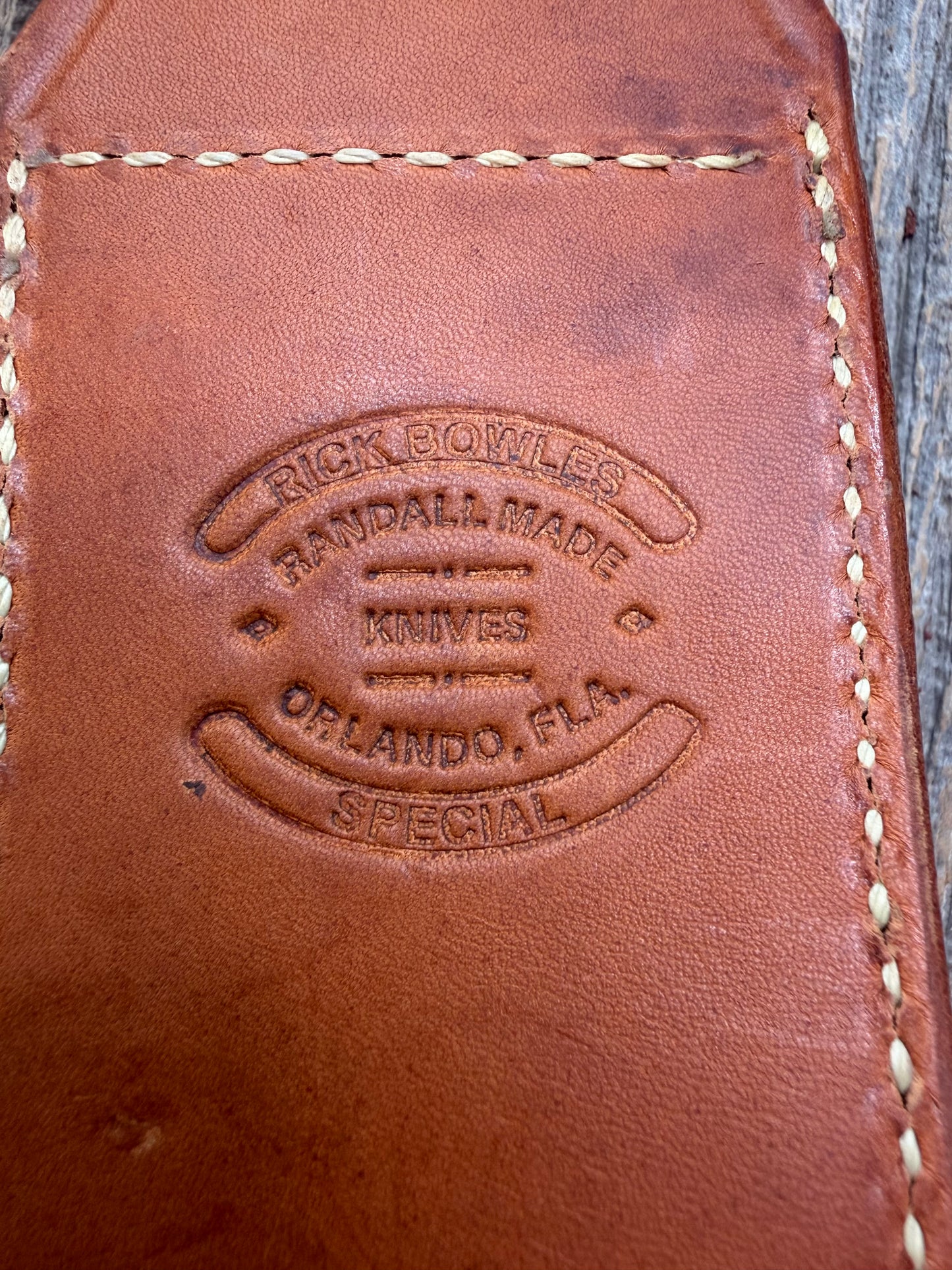 Randall by Gutcher Knife Sheath for a Model Rick Bowles Special.  Randall snaps, pouch with stone. Tuff sheath.