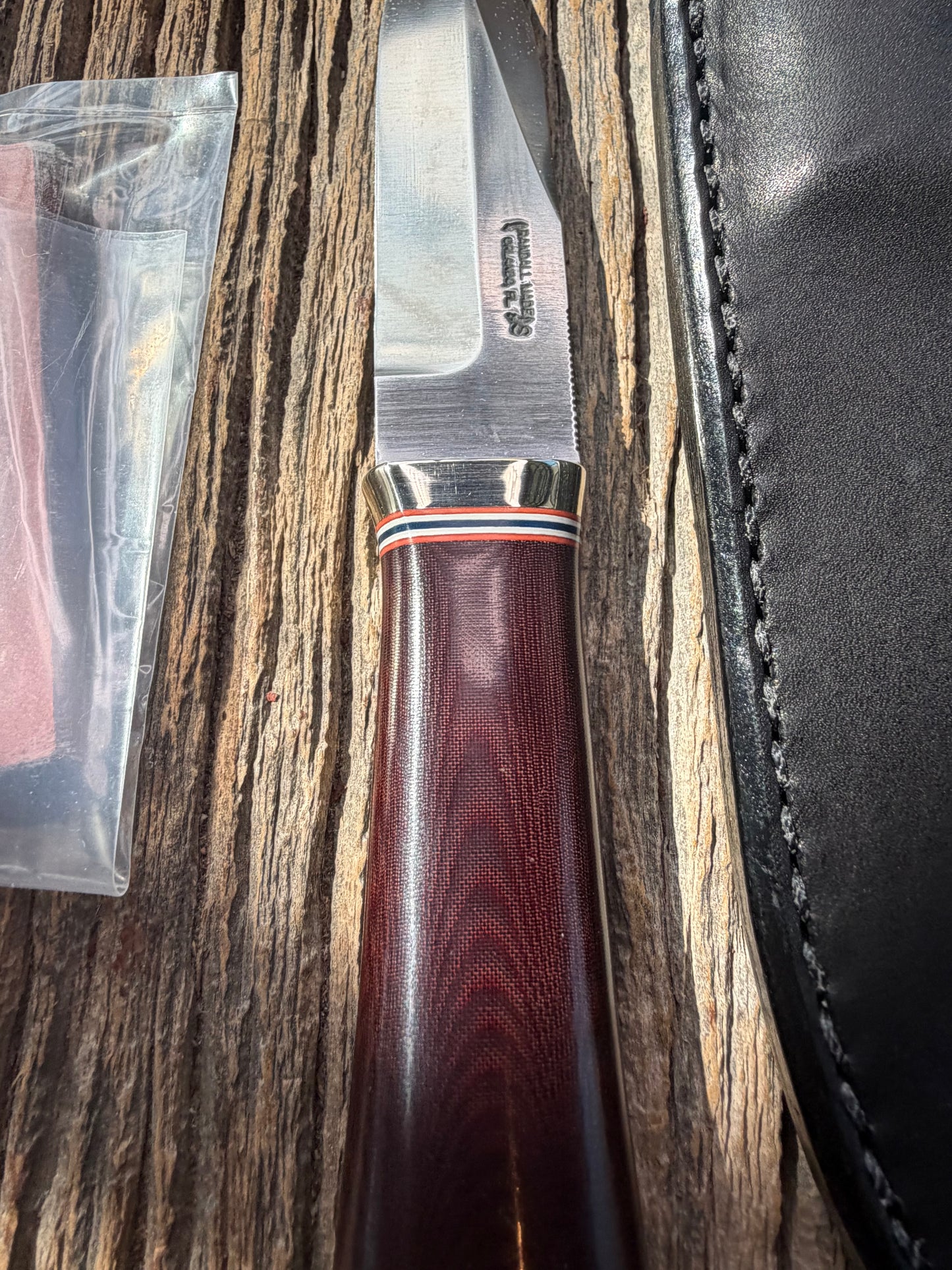 New in Paper Randall Model “Gambler” 4 Inch in a Maroon Micarta handle, Nickel hilt, Stainless steel blade, rounded nickel silver butt cap.