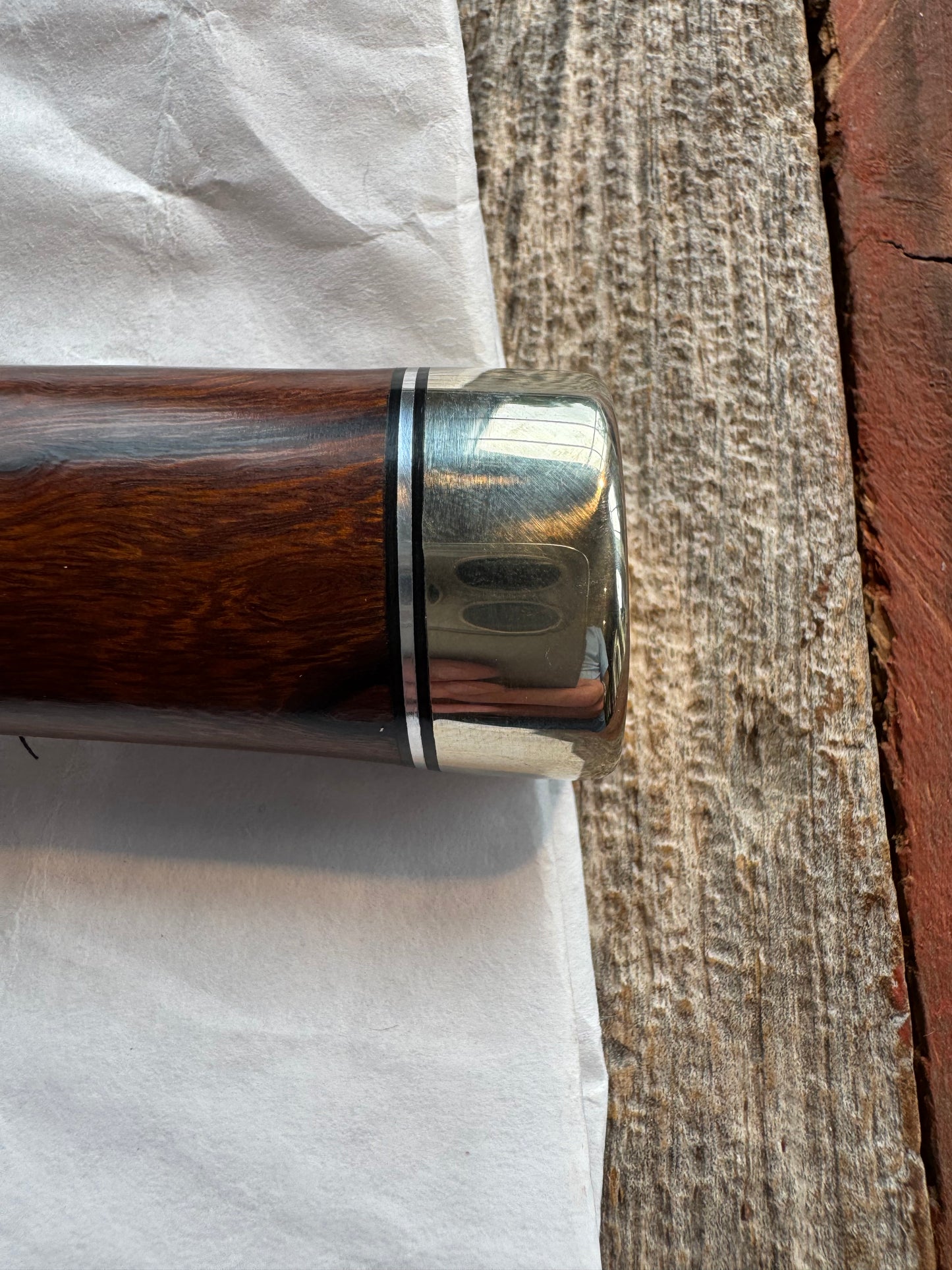 New in Paper Randall Model 1-7 Stainless steel blade, Nickel silver hilt and butt cap. Brown leather sheath. Burl wood handle.