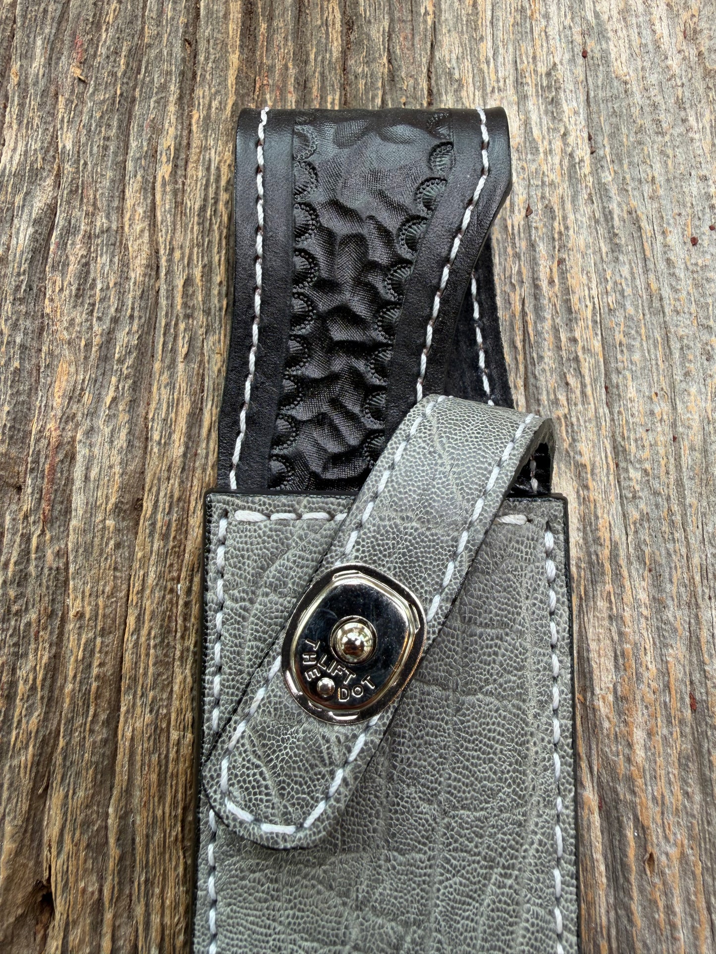New Randall Model 1-8 Sheath in Exotic thick and textured Grey Elephant Hide on black leather from Treeman with a silver Canteen snap. Hand tooled belt loop. Killer sheath.