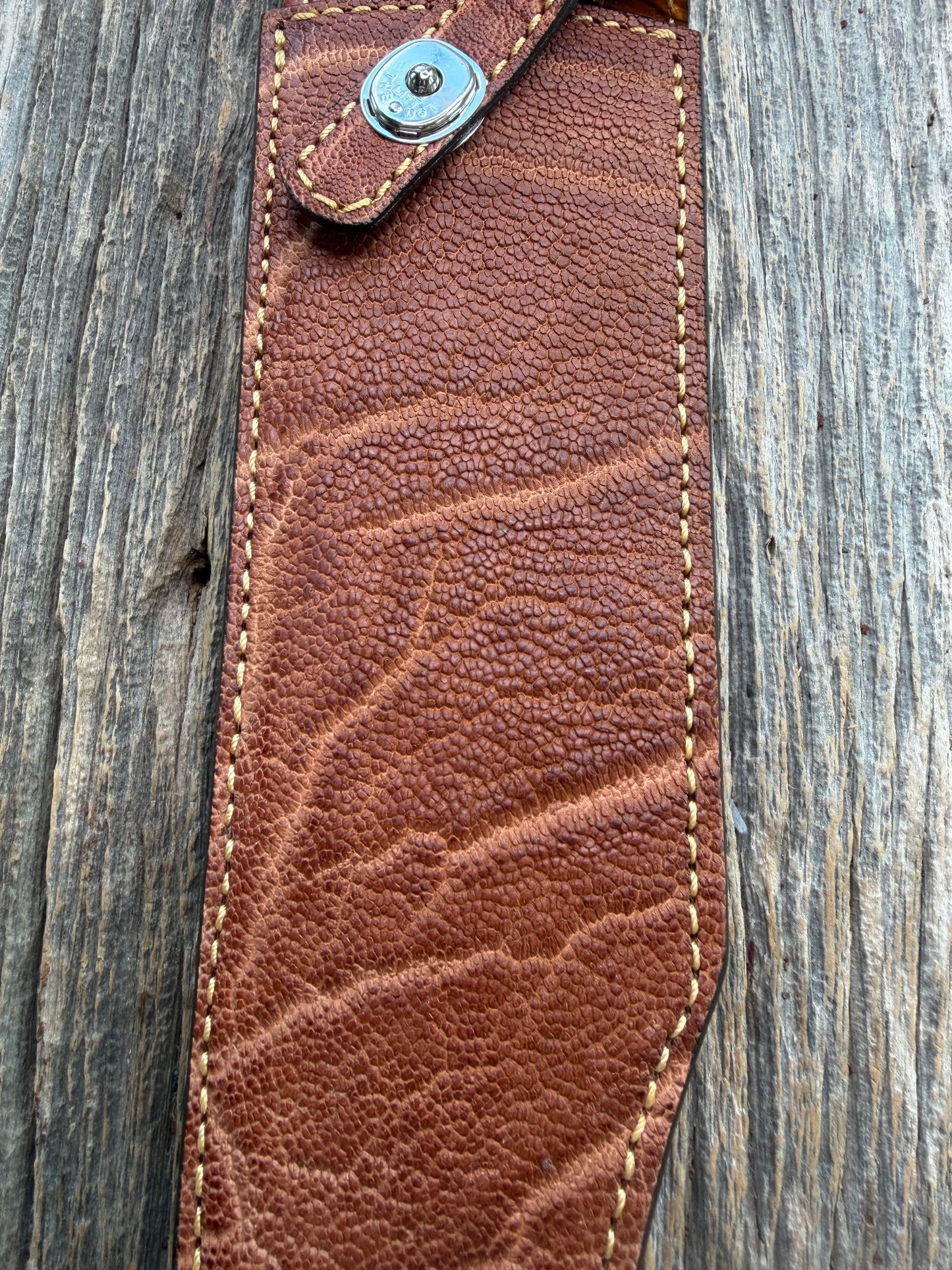New Randall Model 12-11 Smithsonian Sheath in Exotic thick and textured Rust colored Elephant hide on brown leather from Treeman with a silver Canteen snap. Hand tooled belt loop. Killer sheath.