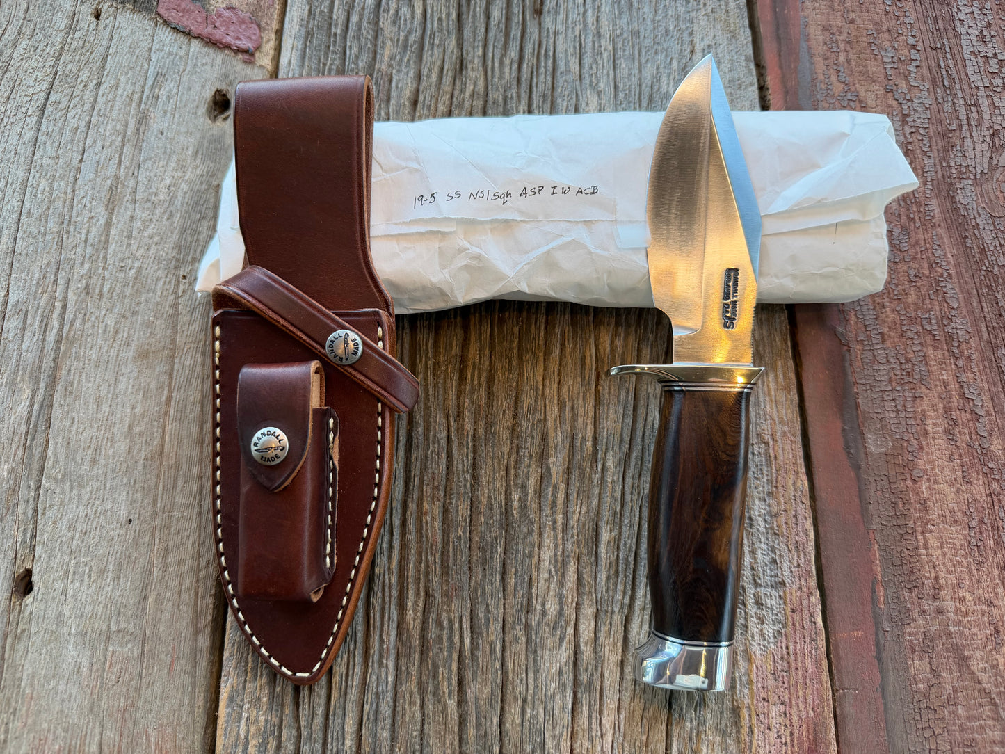 New in Paper Randall Model 19-5 with a nice piece of Ironwood. Nickel silver Hilt and Aluminum crows beak Butt cap.
