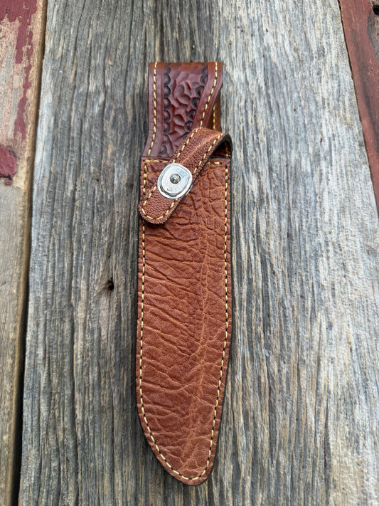 New Randall Model 1-7 Sheath in Exotic thick and textured Rust colored Elephant hide on brown leather from Treeman with a silver Canteen snap. Hand tooled belt loop. Killer sheath.