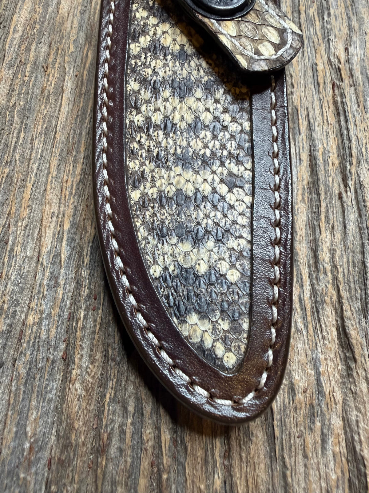 Randall Model 28 sheath with an Eastern Diamondback RattleSnake skin from Treeman Sheaths. Hand tooled belt loop, canteen snap. Vibrant colors and one of the hardest skins to source.
