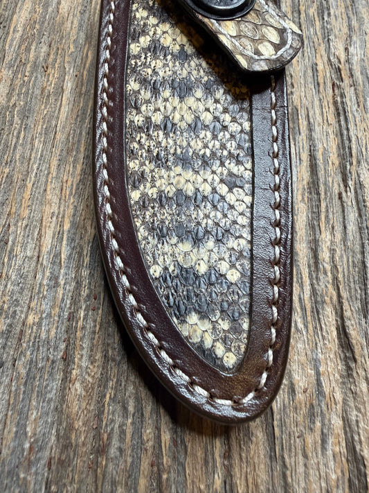 Randall Model 28 sheath with an Eastern Diamondback RattleSnake skin from Treeman Sheaths. Hand tooled belt loop, canteen snap. Vibrant colors and one of the hardest skins to source.