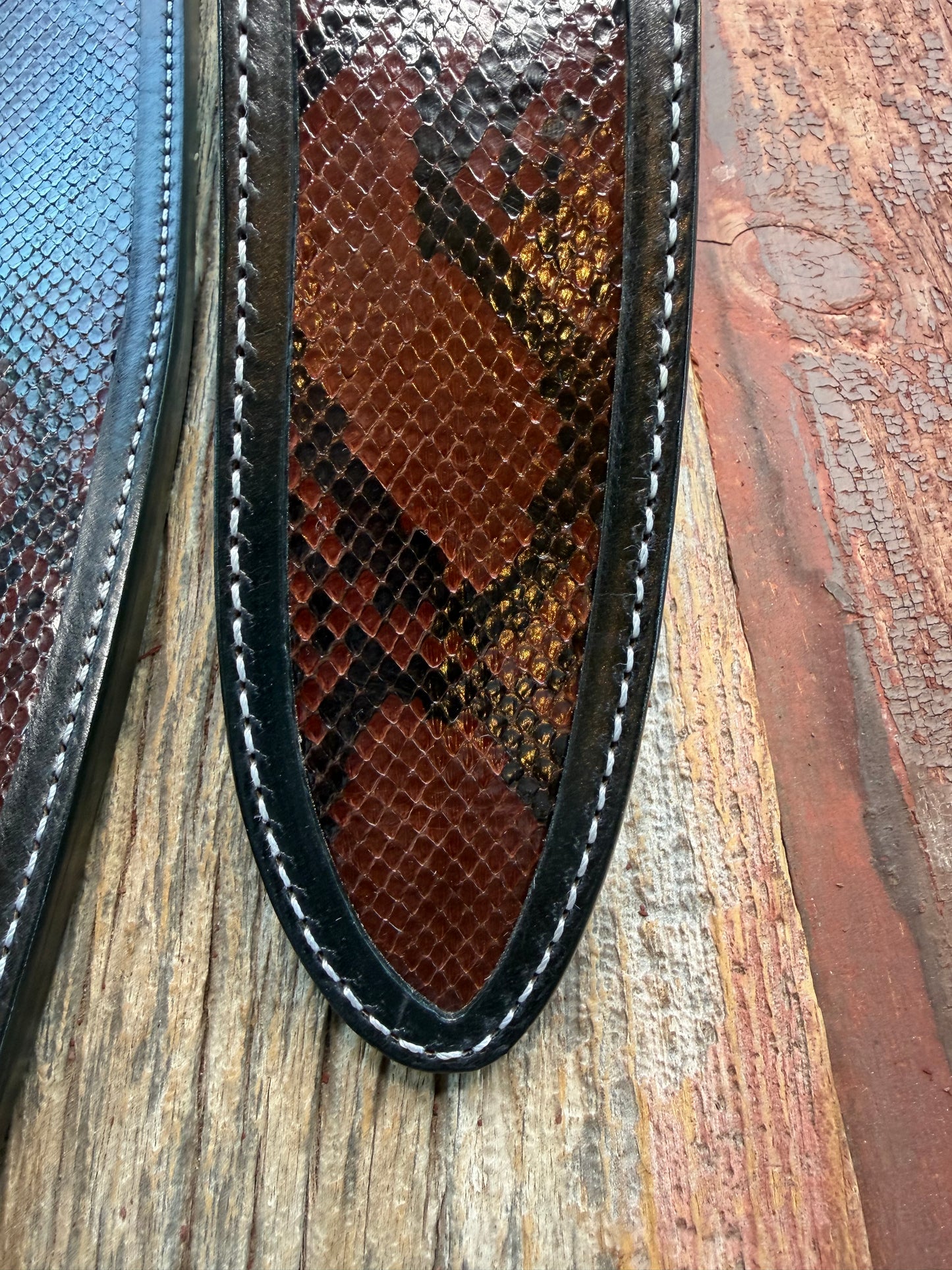 New pair of Randall Model 12-11 Large Sasquatch and 12-8 Small Sasquatch Sheath in Exotic Brown Python Snake on black leather from Treeman with a black Canteen snap. Hand tooled belt loop. Deviated white stitching. Killer sheath.
