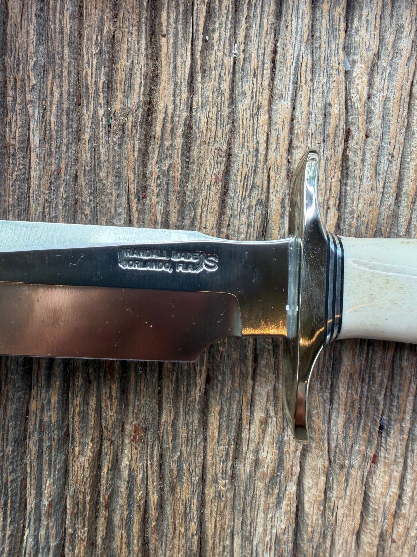 New in Paper Randall Made Knife Model 1-7 Stag , Stainless, Black and Aluminum spacers, Nickel Silver Hilt, Aluminum crows beak butt cap.