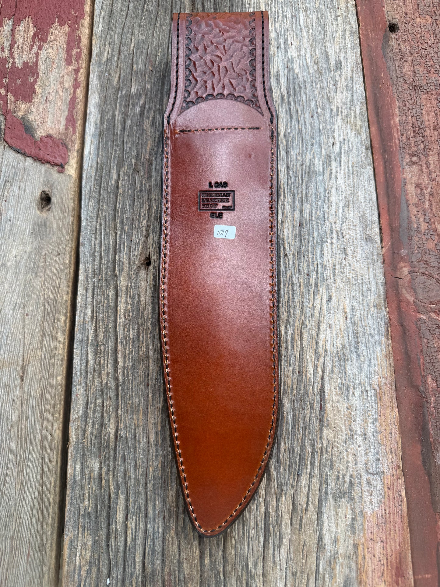 New Randall Model 12-11 Large Sasquatch Sheath in Exotic thick and textured Rust colored Elephant hide on brown leather from Treeman with a black Canteen snap. Hand tooled belt loop. Killer sheath.