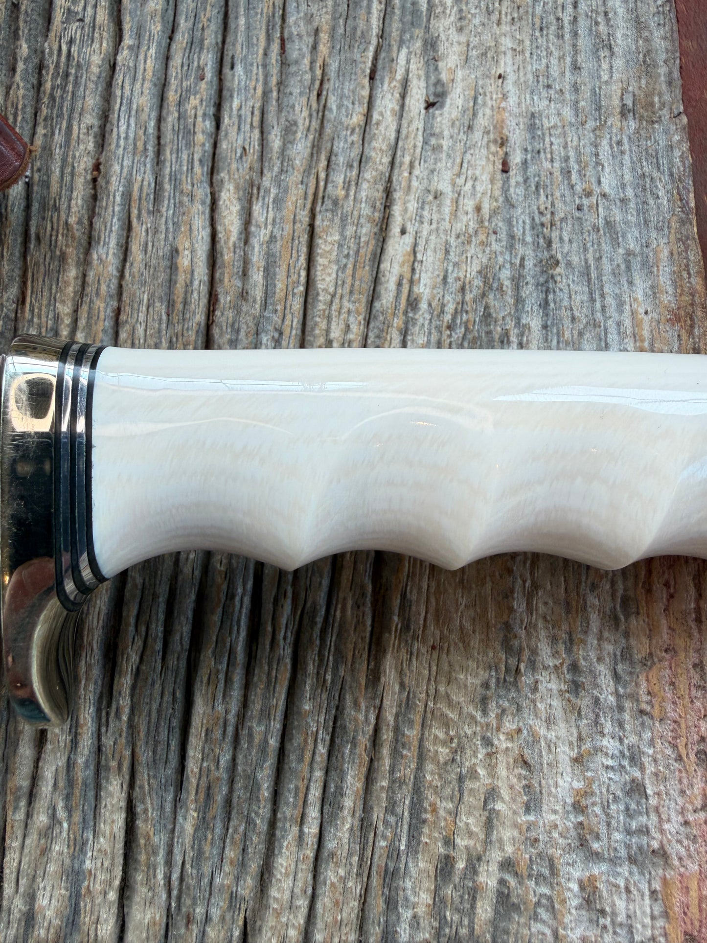 Randall Model Combat Companion with a nice piece of customer supplied Warthers Resin with finger grooves. Teeth, Nickel Silver Hilt and a raw natural end.