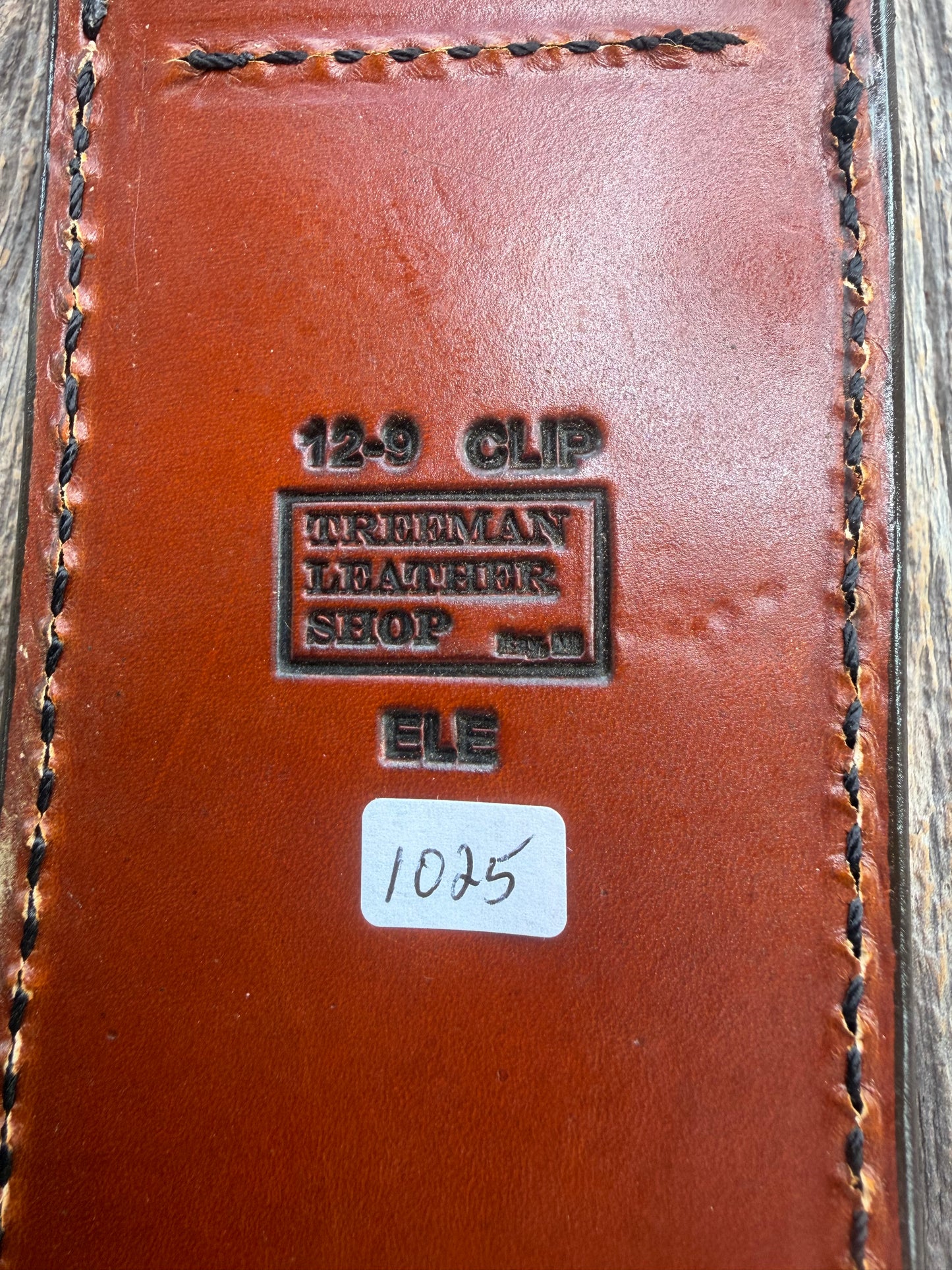 New Randall Model 12-9/14 Sheath in Exotic thick and textured Rust colored Elephant hide on brown leather from Treeman with a black Canteen snap. Hand tooled belt loop. Killer sheath.