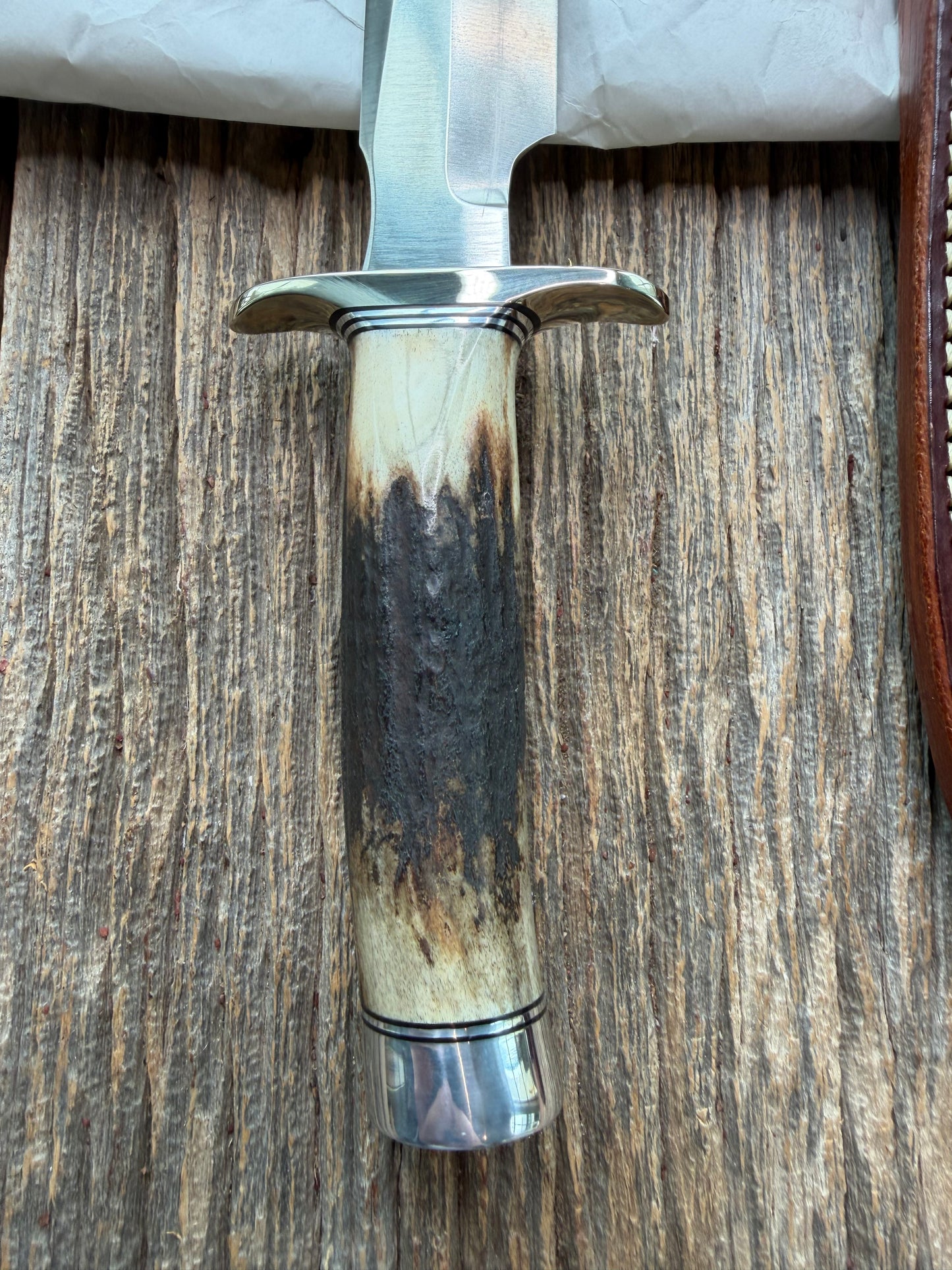 New in Paper Randall Made Knife Model 1-7 Darkened Stag , Stainless, Black and Aluminum spacers, Nickel Silver Hilt, Aluminum butt cap.
