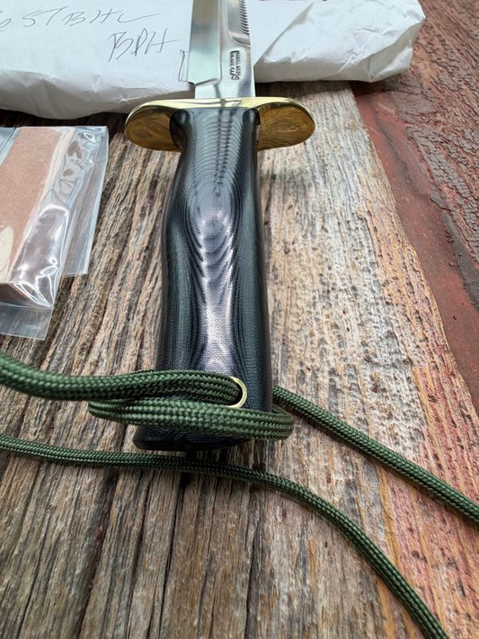 New in Paper Randall Model 16-7 Diver with a Black Micarta handle. SS blade, Brass hilt, Sawteeth, Lanyard, Brown leather waxed sheath.