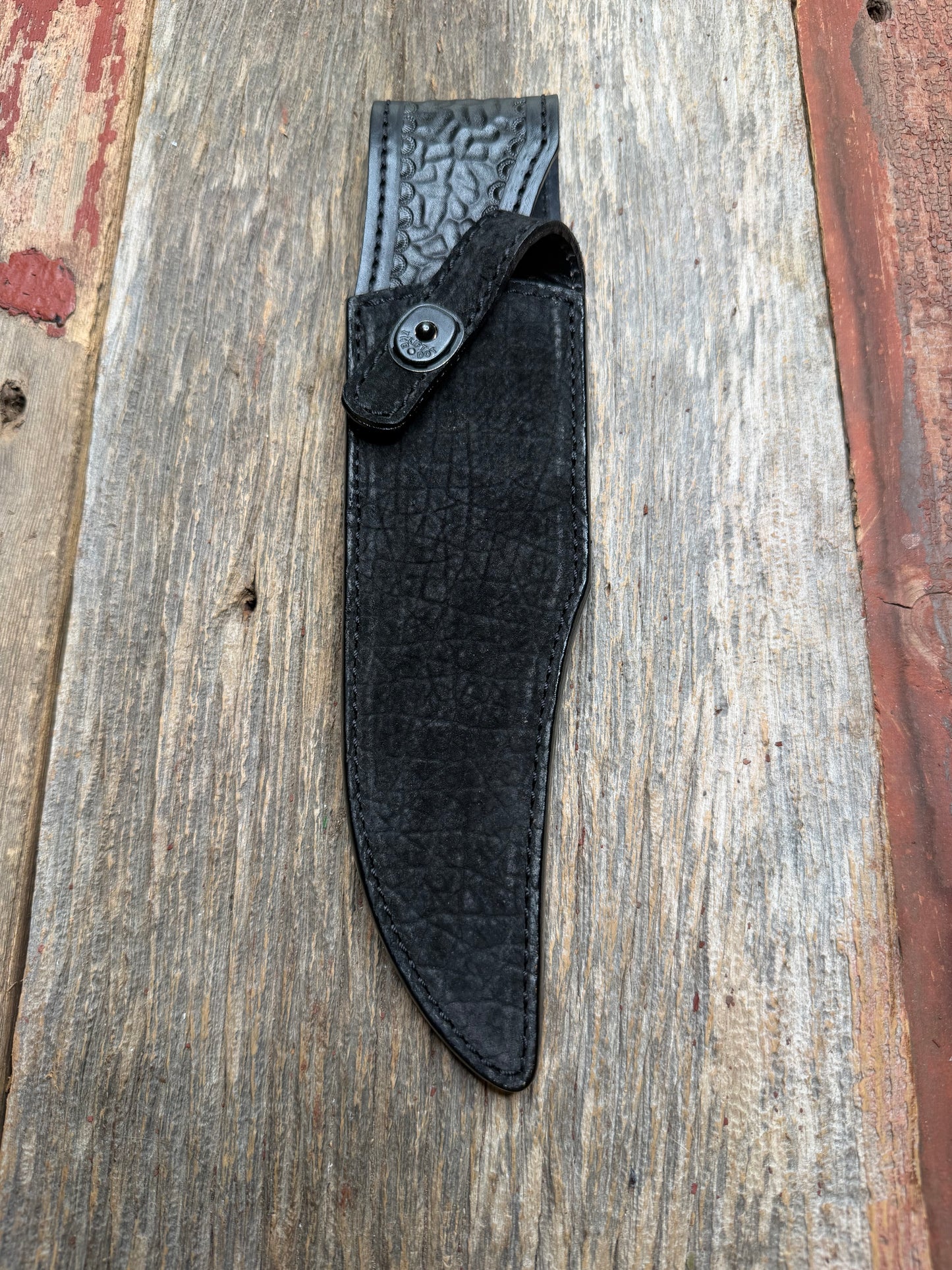 Randall Model 12-8 “Big Bear” in Black Hippo, forward curved hilt, black Canteen Snap, full brass stamping and stitching.