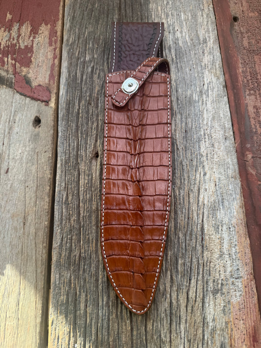 New Randall Model 12-11 Large Sasquatch Sheath in Exotic thick and textured Honey Crocodile skin ( tail portion) on brown leather from Treeman with a silver Canteen snap. Hand tooled belt loop. Killer sheath.