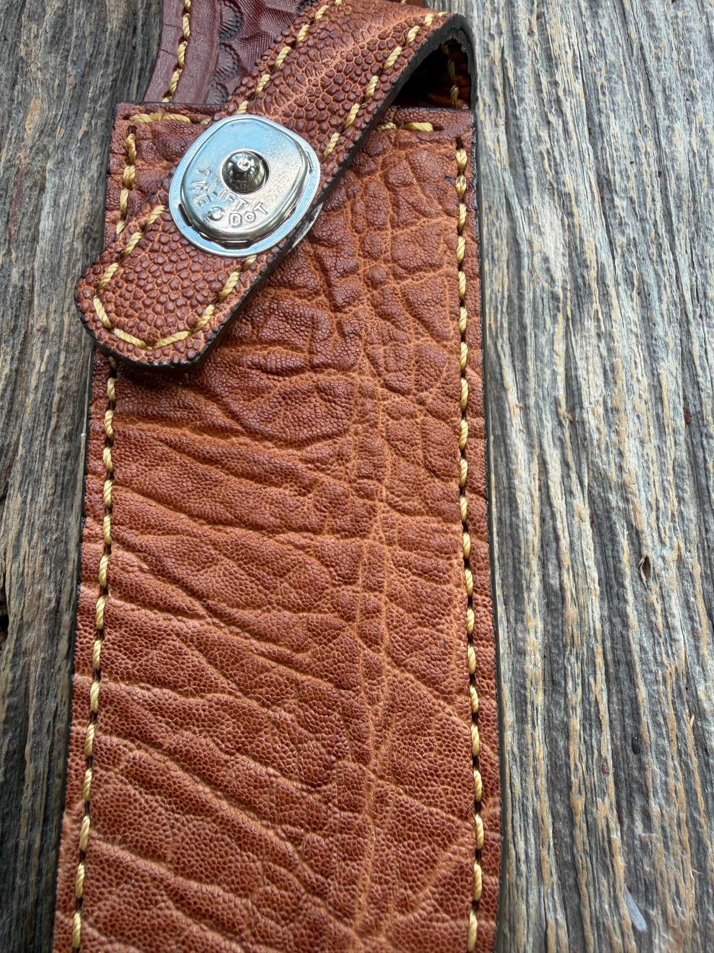 New Randall Model 1-7 Sheath in Exotic thick and textured Rust colored Elephant hide on brown leather from Treeman with a silver Canteen snap. Hand tooled belt loop. Killer sheath.