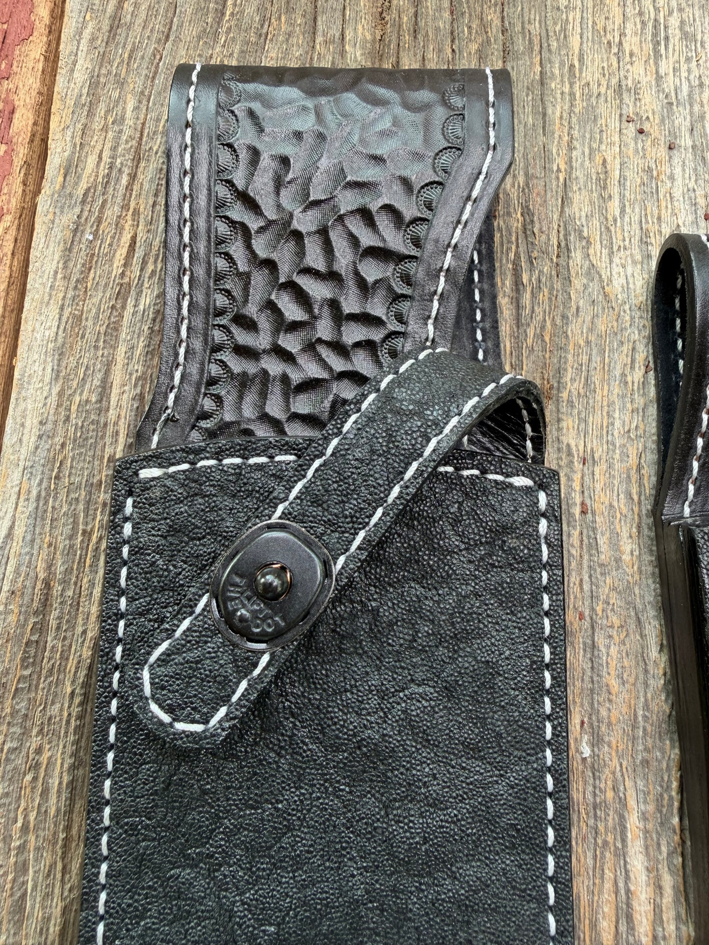 New Randall Model 12-11 Large Sasquatch and 12-8 Small Sasquatch Sheaths in Exotic thick and textured Black Elephant hide on black leather from Treeman with a black Canteen snap. Hand tooled belt loop. Killer sheath. Selling as a pair…