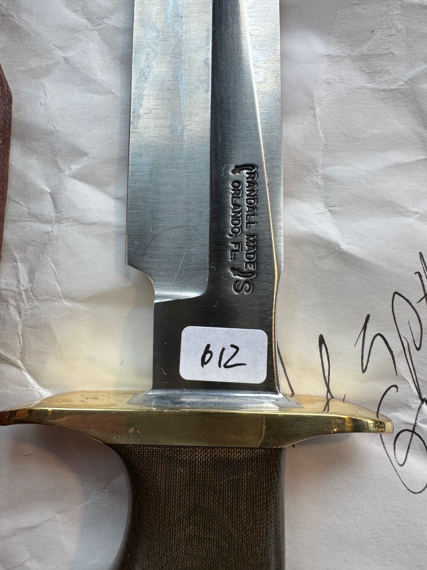 New in Paper Randall Model 16 SP#1 Special fighter with a Green Micarta handle. SS blade, Brass hilt. Lanyard. Brown leather sheath.