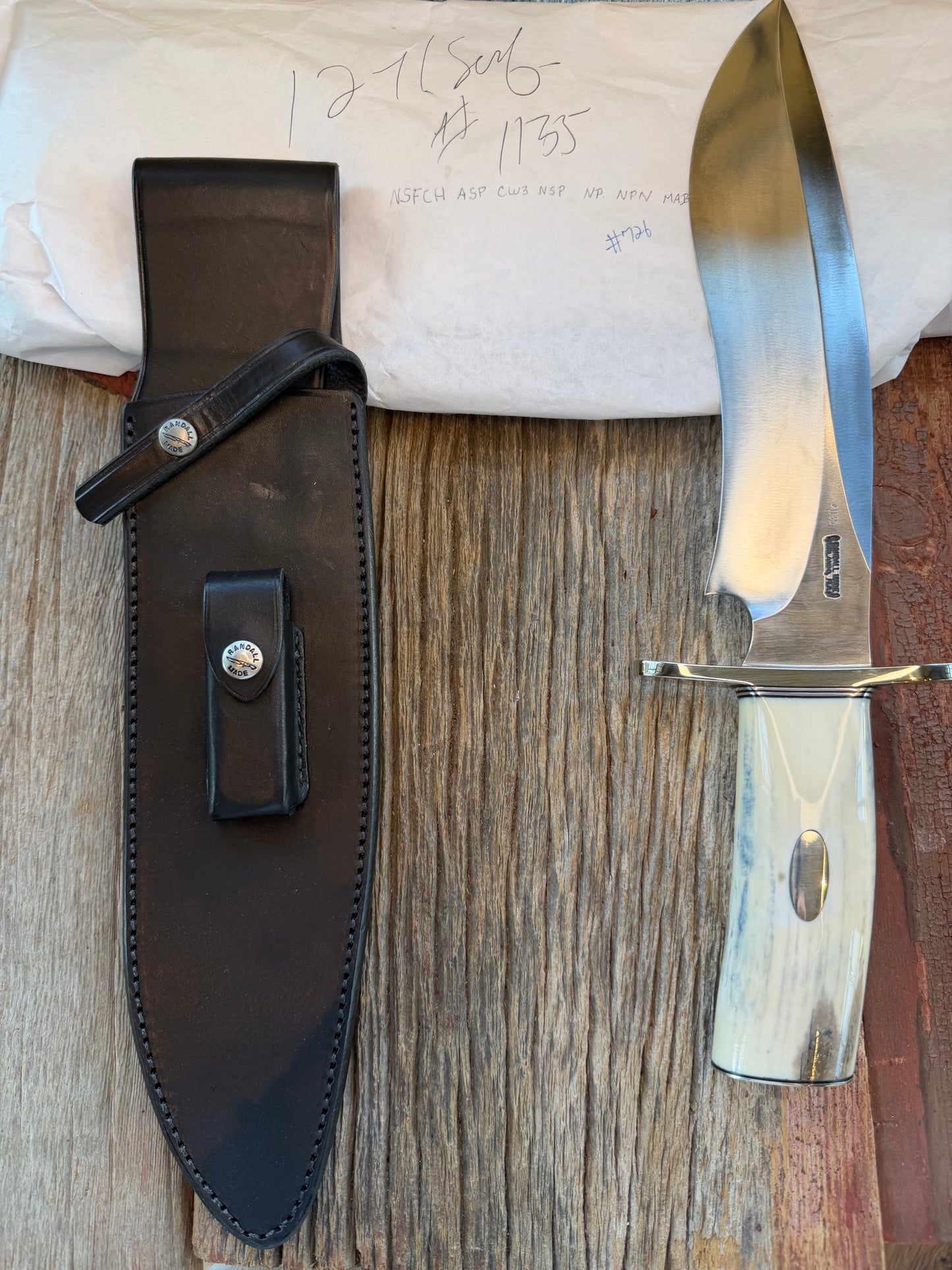 New in Paper Randall Model 12-11 Dealer Special Large Sasquatch Huge piece of Pearly White/Blue Fossil Walrus Ivory, # 1135 Nickel Silver Hilt and butt cap, nickel nameplate.