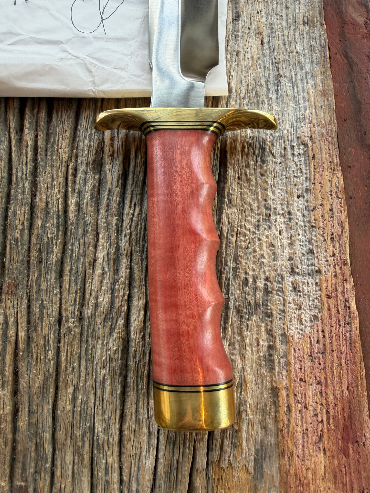 New in Paper Randall Made Knife Model 1-8 in Pink Ivory wood. Stainless steel, Black and Gold spacers, Brass Hilt and butt cap.