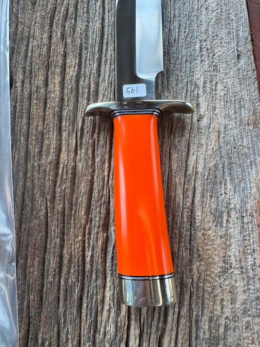 New in paper Randall Model 14 CDT with a nice piece of customer supplied Orange G10. Stainless Steel, Nickel Silver Hilt and Butt cap.