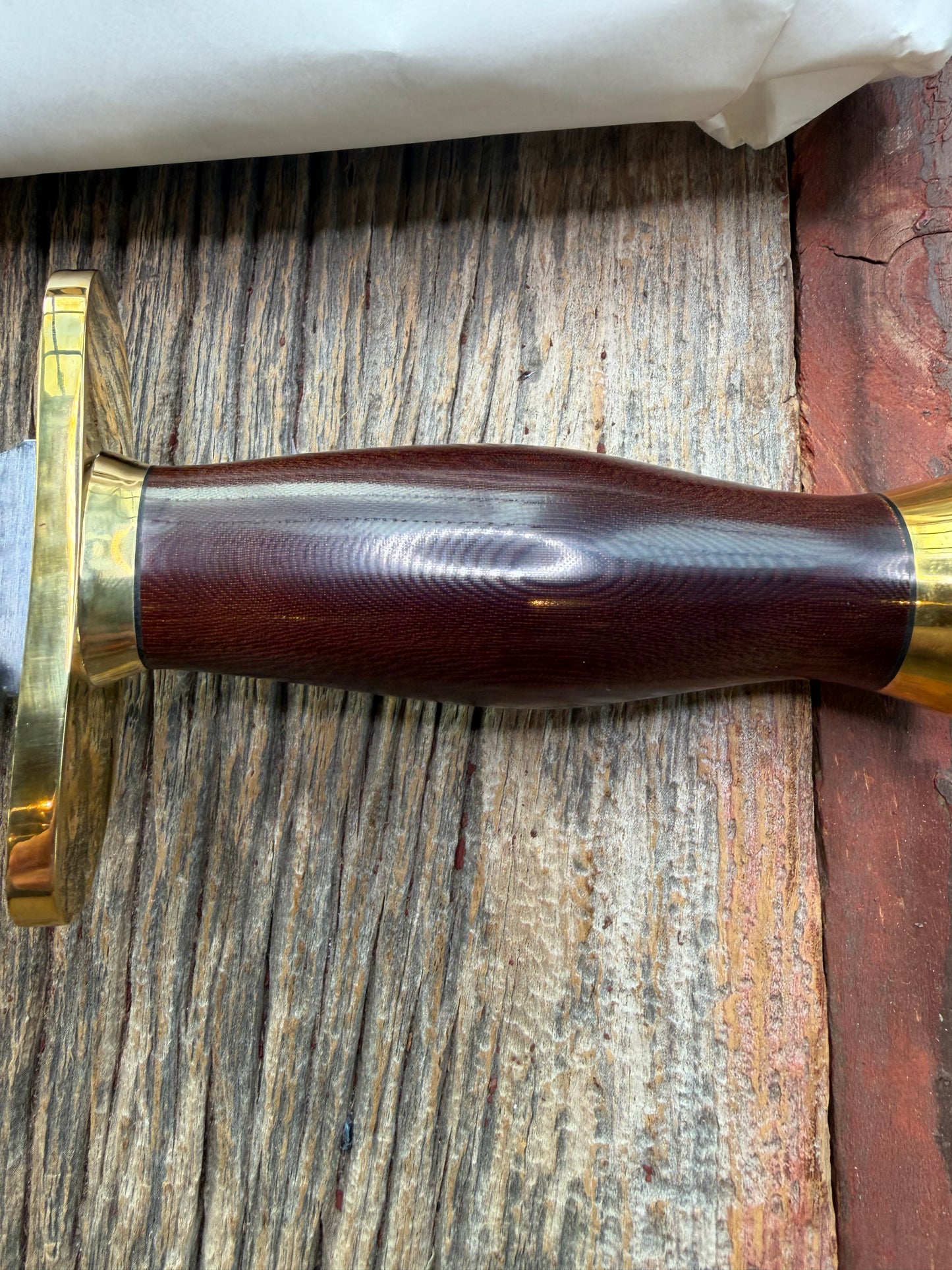 New in Paper Randall Model 12-8 Big Bear with a Maroon Micarta handle. Brass Hilt  and Brass collar, Carbon steel, brass butt cap.