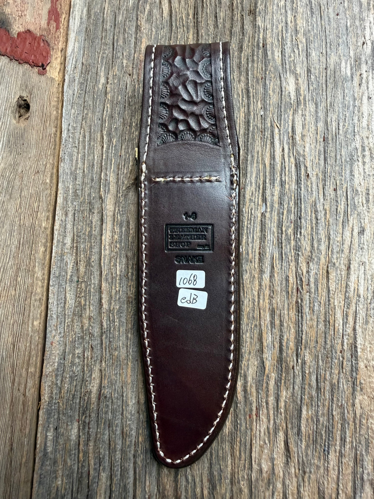 Randall Model 1-6 sheath with an Eastern Diamondback RattleSnake skin from Treeman Sheaths. Hand tooled belt loop, canteen snap. One the hardest skins to source.
