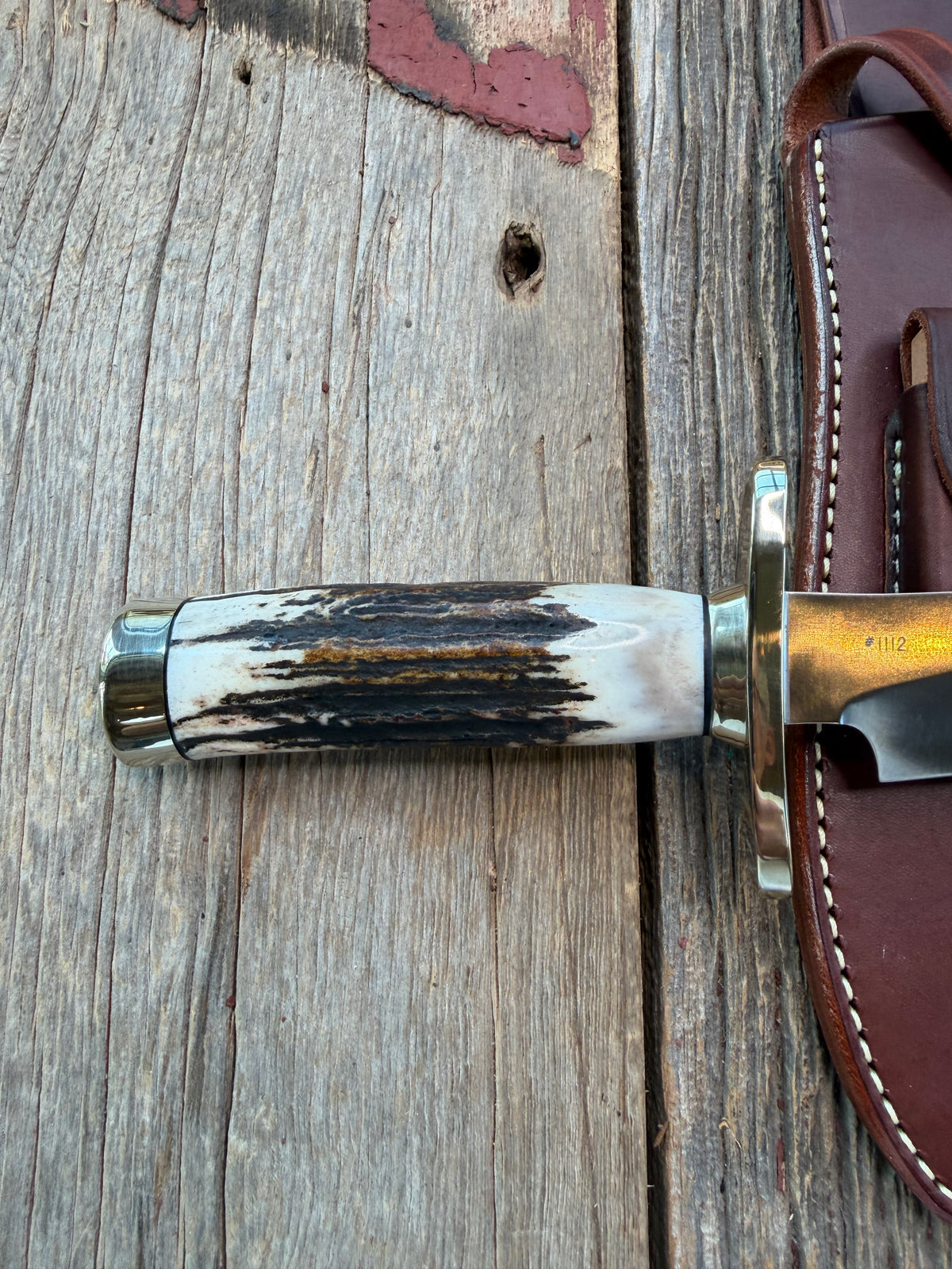 New in Paper Randall Model 12-8 Small Sasquatch with a really nice piece of stag. #1112, Nickel Silver collar and butt cap.