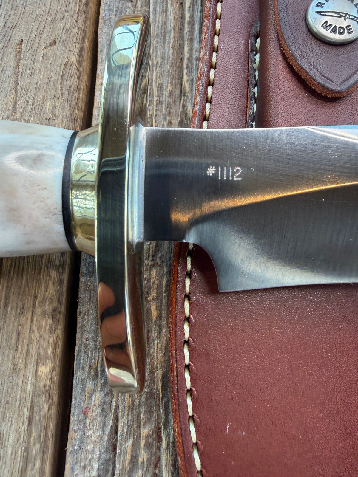 New in Paper Randall Model 12-8 Small Sasquatch with a really nice piece of stag. #1112, Nickel Silver collar and butt cap.