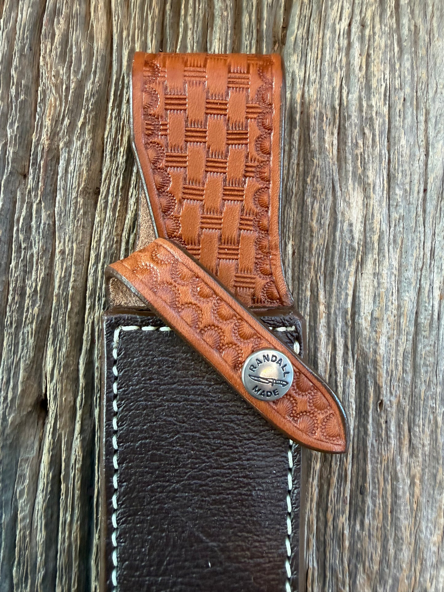 New Randall Model 4-7 Sheath in Exotic Brown Cape Buffalo with full leather hand tooled belt loop. Randall snap and stamp on the back. Custom Made at Sullivan’s by Gutcher