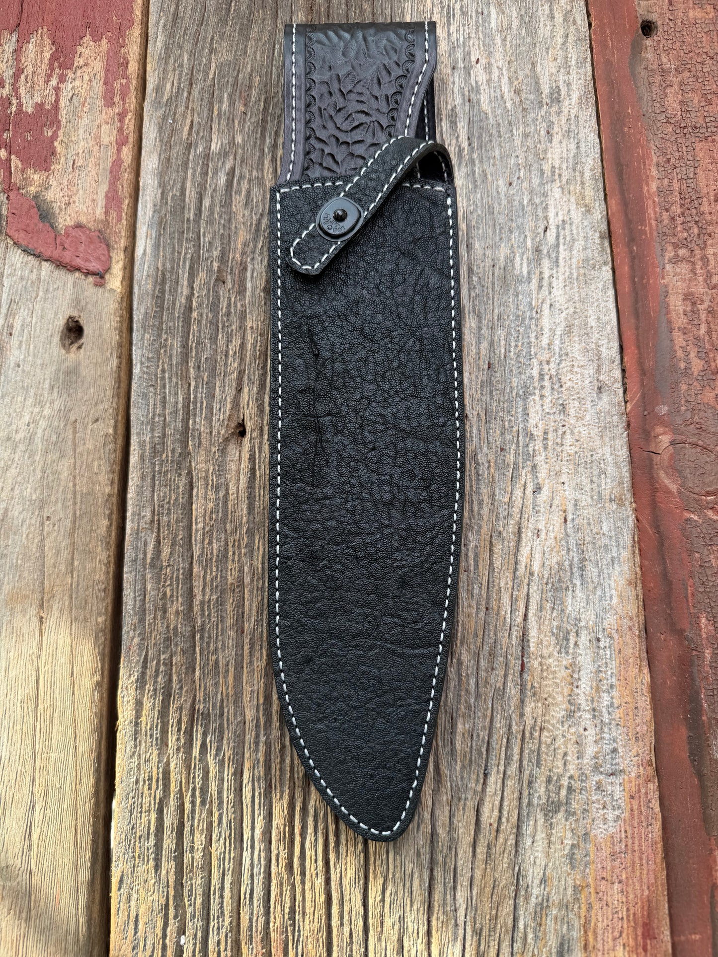 New Randall Model 12-11 Large Sasquatch Sheath in Exotic thick and textured Black Elephant hide on black leather from Treeman with a black Canteen snap. Hand tooled belt loop. Killer sheath.