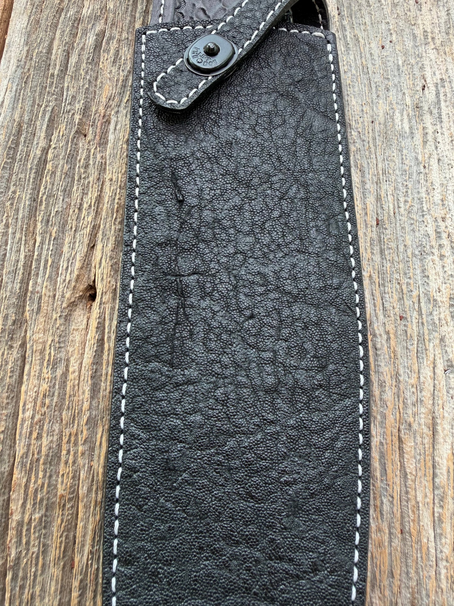New Randall Model 12-11 Large Sasquatch Sheath in Exotic thick and textured Black Elephant hide on black leather from Treeman with a black Canteen snap. Hand tooled belt loop. Killer sheath.