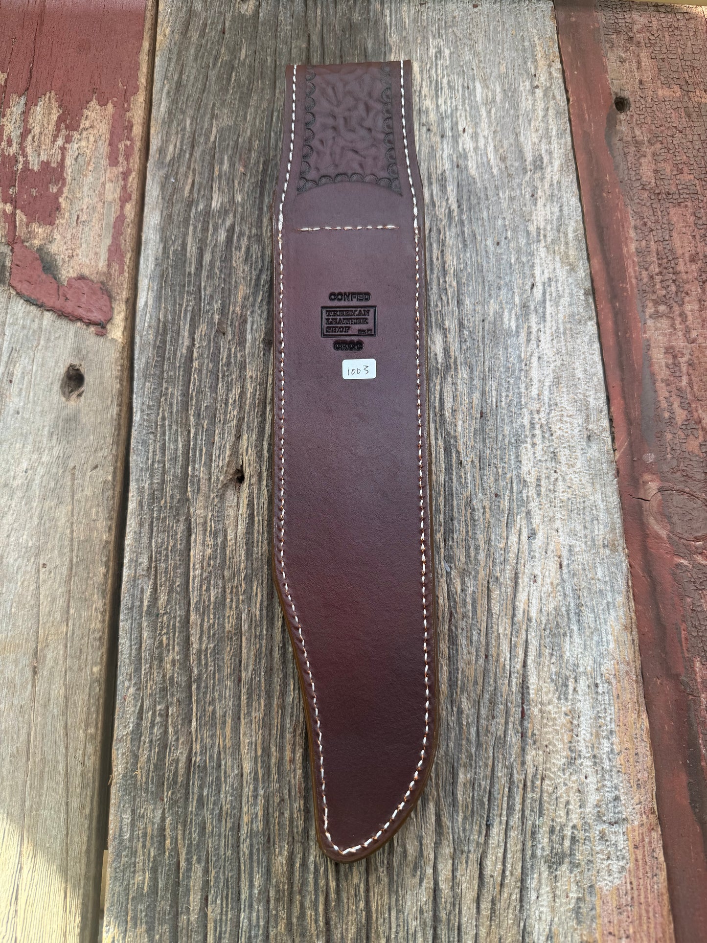 New Randall Model 12-11 Confederate Sheath in Exotic thick and textured Honey Crocodile skin ( tail portion) on brown leather from Treeman with a silver Canteen snap. Hand tooled belt loop. Killer sheath.