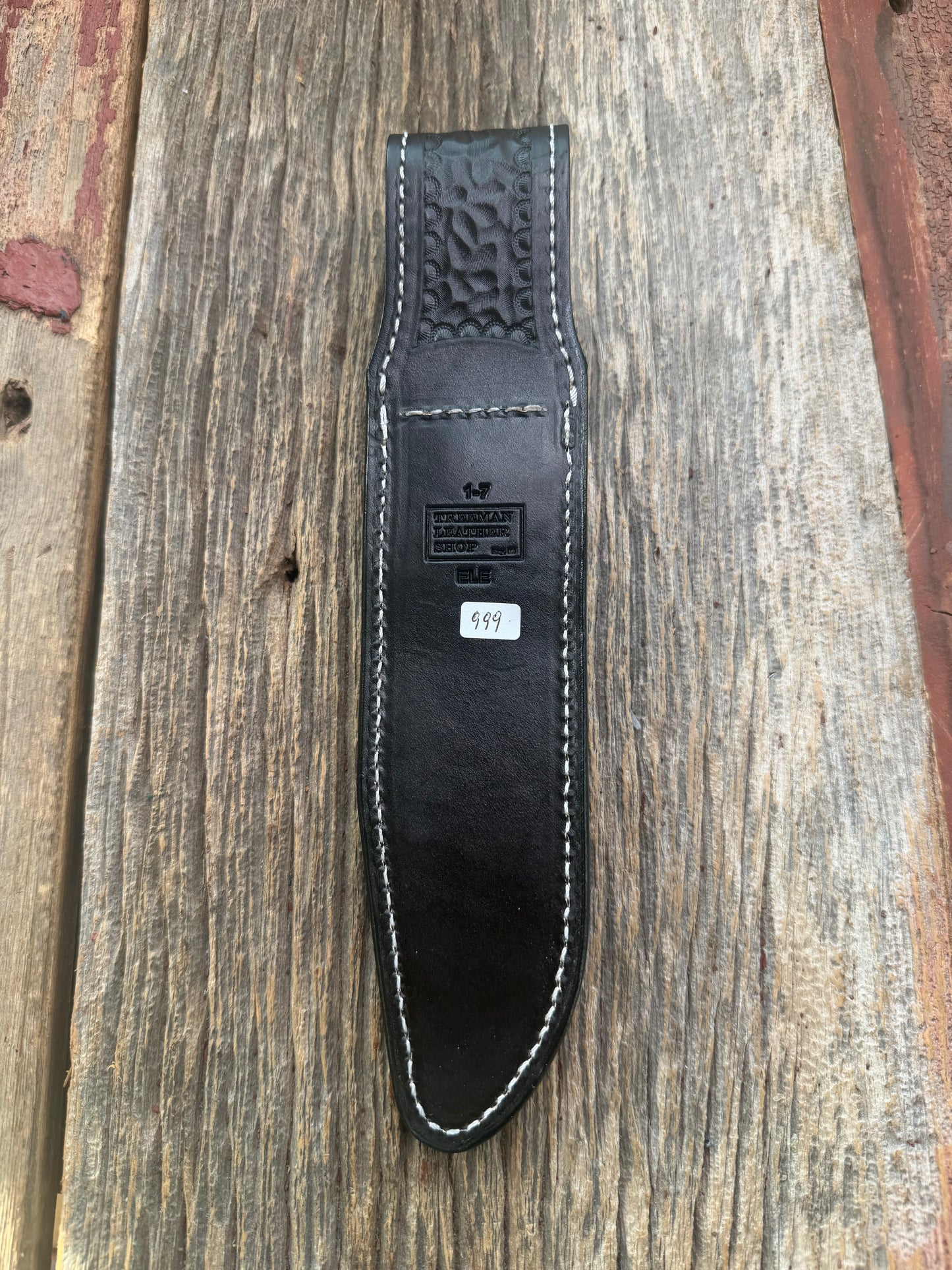 New Randall Model 1-7 Sheath in Exotic thick and textured Black Elephant hide on black leather from Treeman with a black Canteen snap. Hand tooled belt loop. Killer sheath.