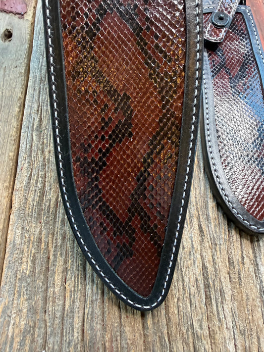 New pair of Randall Model 12-11 Large Sasquatch and 12-8 Small Sasquatch Sheath in Exotic Brown Python Snake on black leather from Treeman with a black Canteen snap. Hand tooled belt loop. Deviated white stitching. Killer sheath.
