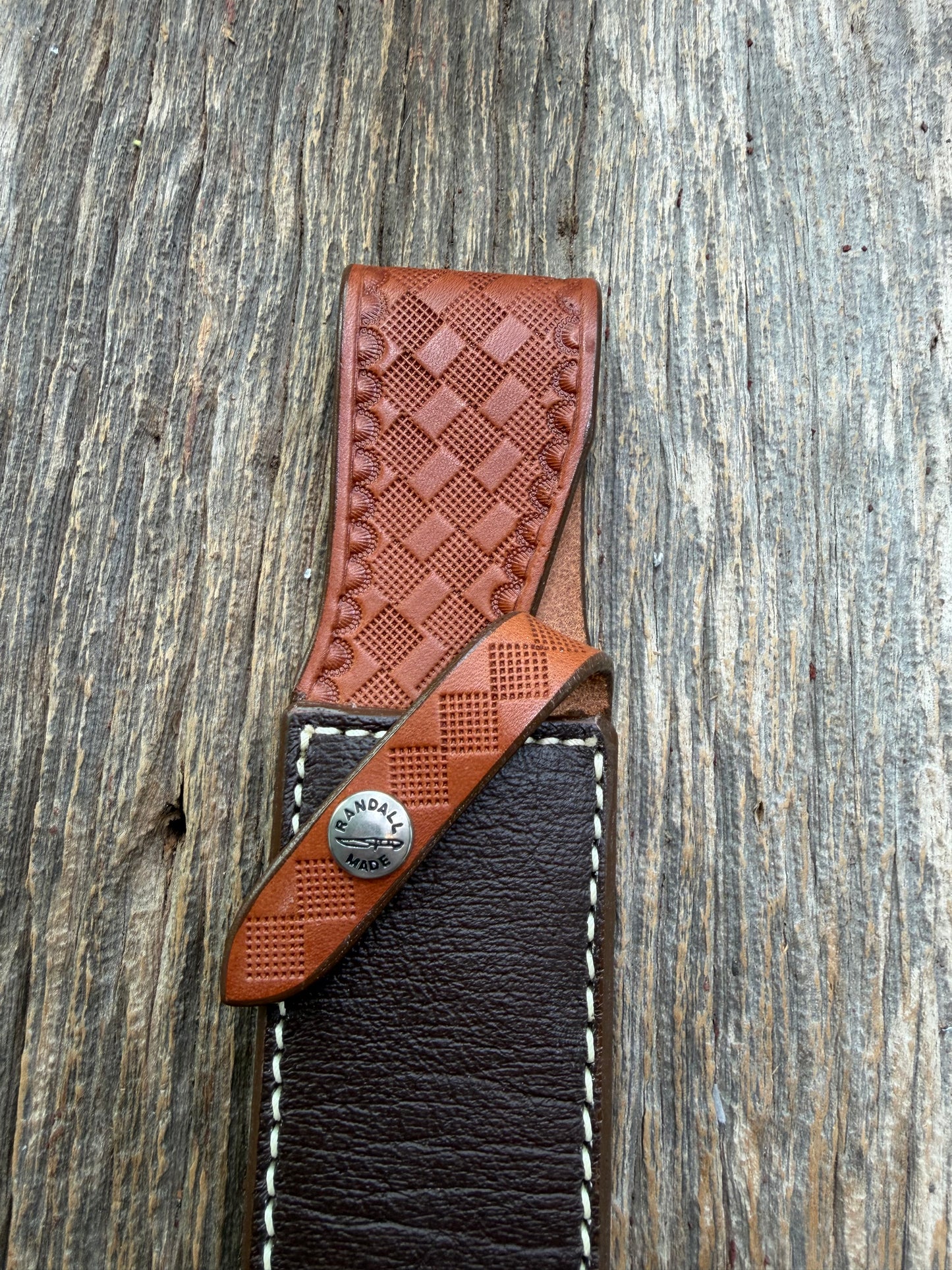 Pristine Randall Model 2-7 sheath in Exotic Cape Buffalo leather from Sullivans by Gutcher. Heavily tooled belt loop and strap. Randall snap and clean stamping on the back … perfect!!