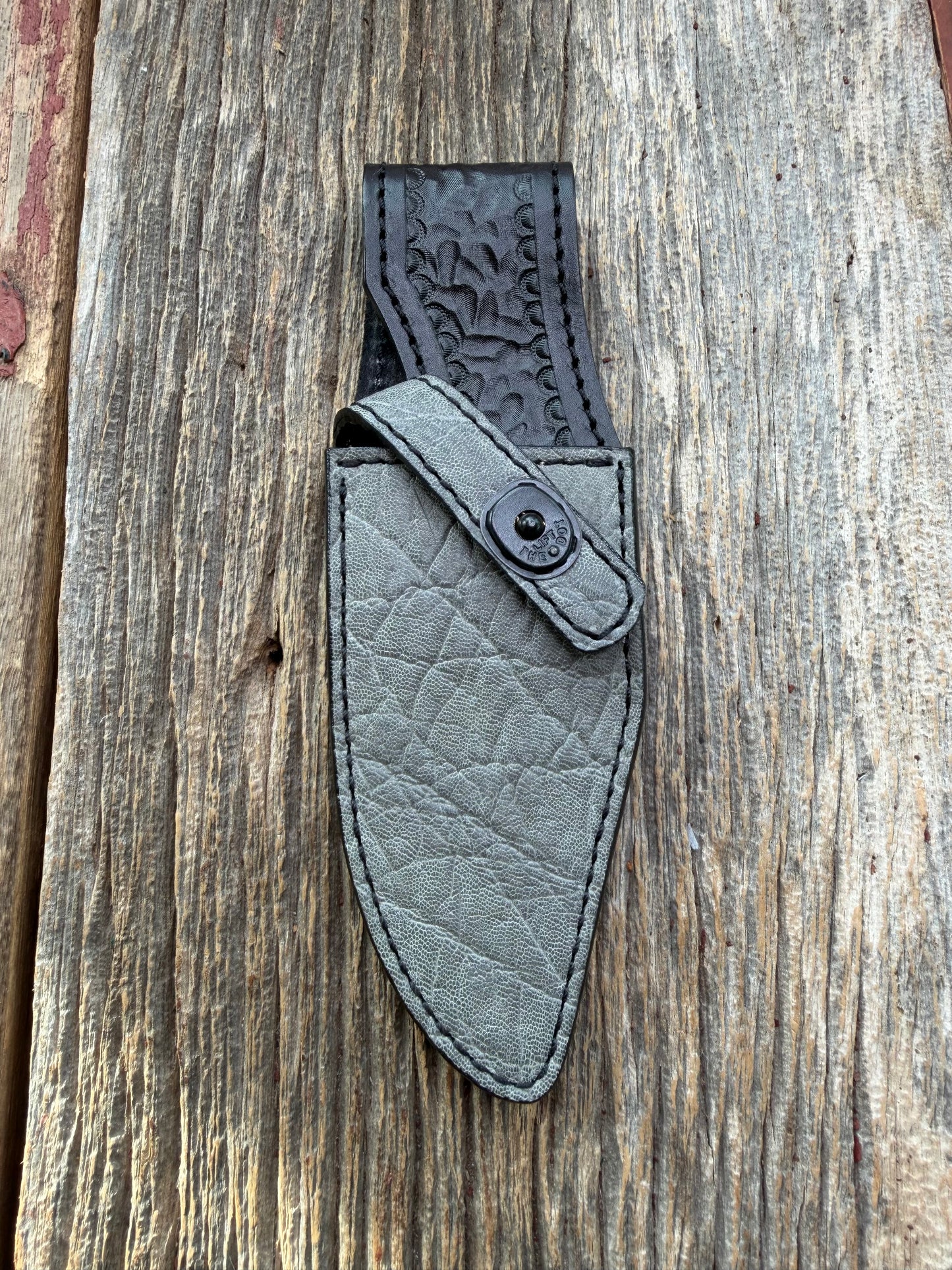 New Randall Model 19-5 Sheath in Exotic thick and textured Grey Elephant Hide on black leather from Treeman with a black Canteen snap. Hand tooled belt loop. Killer sheath.