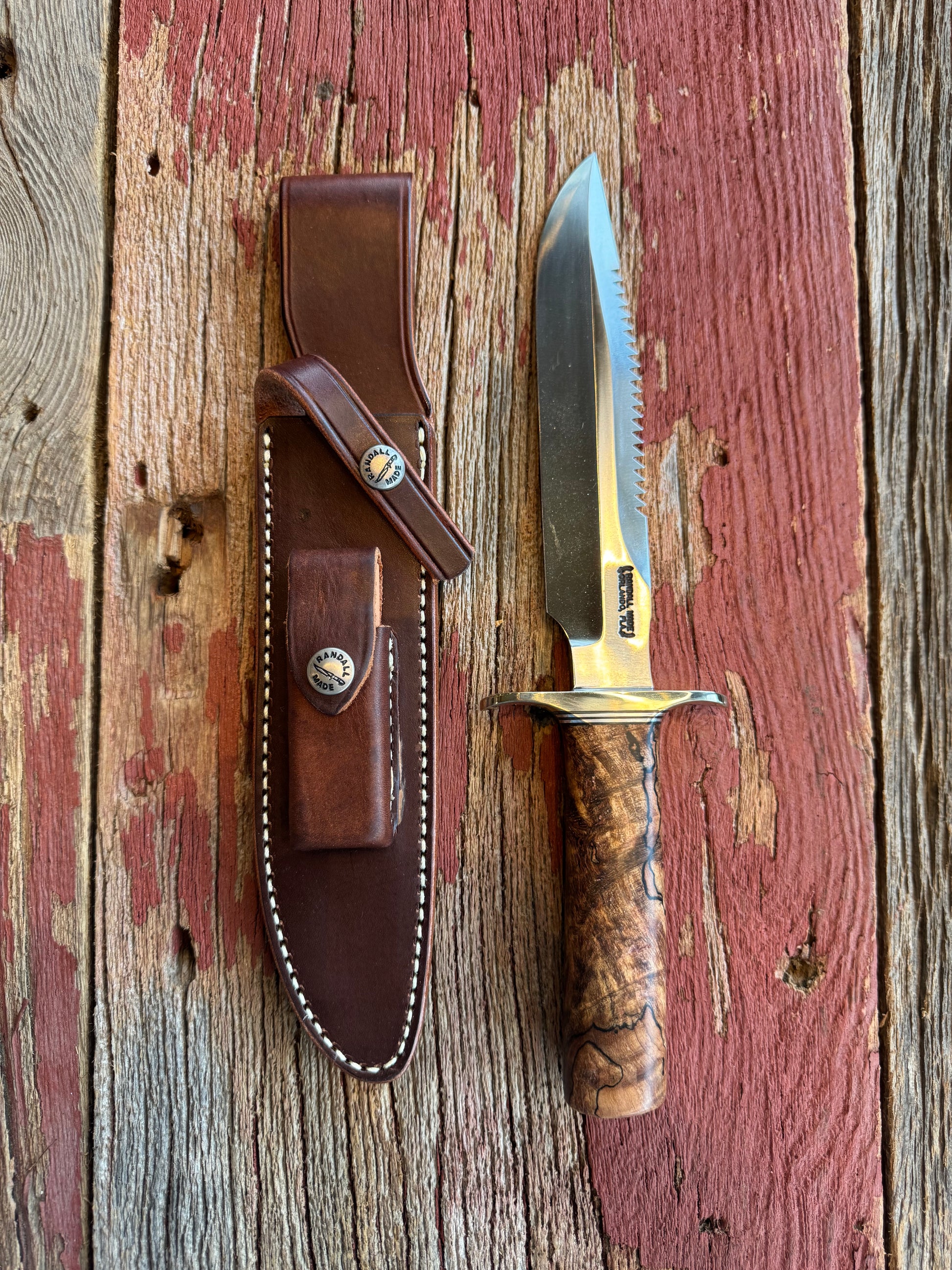 New in paper Randall Knife Model 1-7 Spalted Ebony wood Handle. Carbon Steel Blade, compass and Sawteeth.