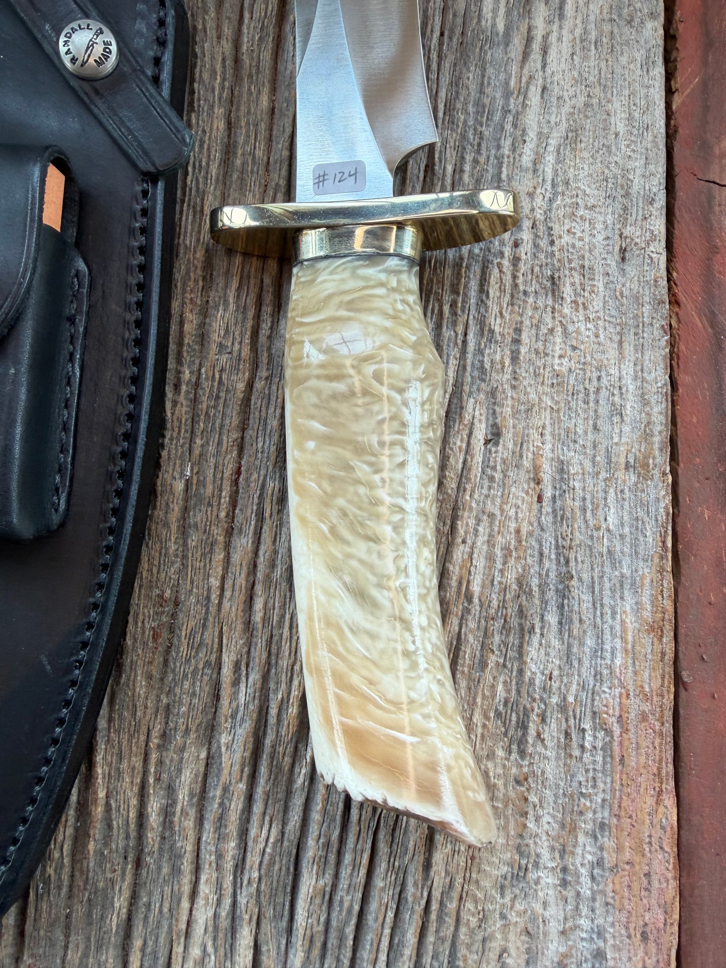 Randall Model 12-8 Small Sasquatch with a nice piece of Musk Ox. Nickel Silver collar and raw natural end.